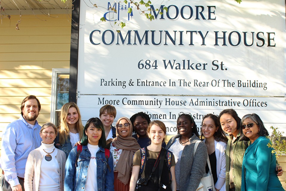 group portrait of students outside Moore Community Room