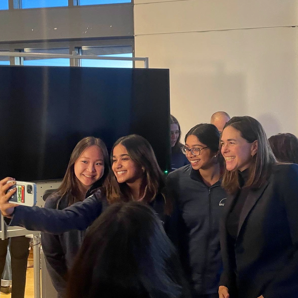 Sian Beilock takes a selfie with three students