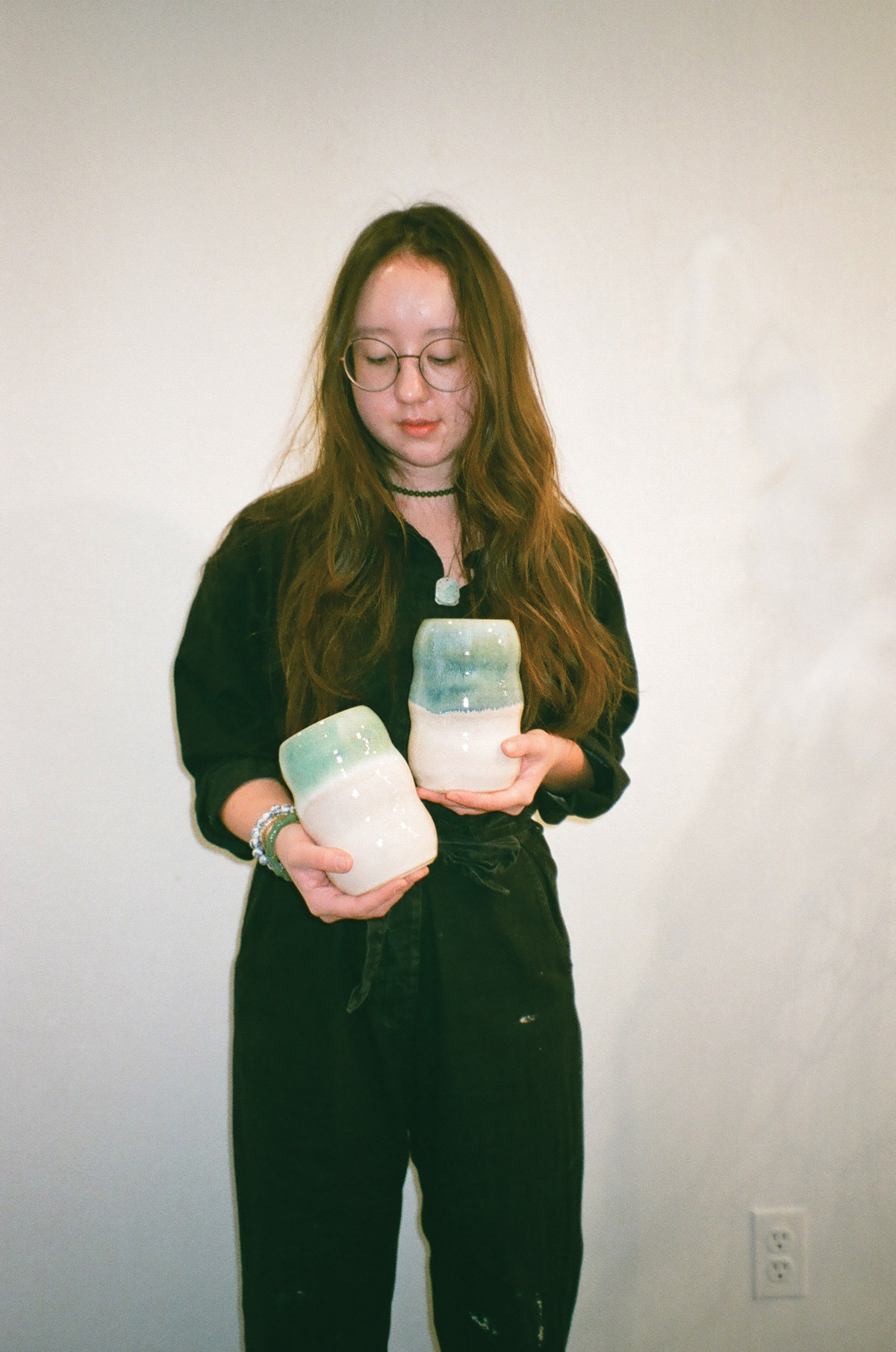 Lilian Wu Finckel holding ceramics