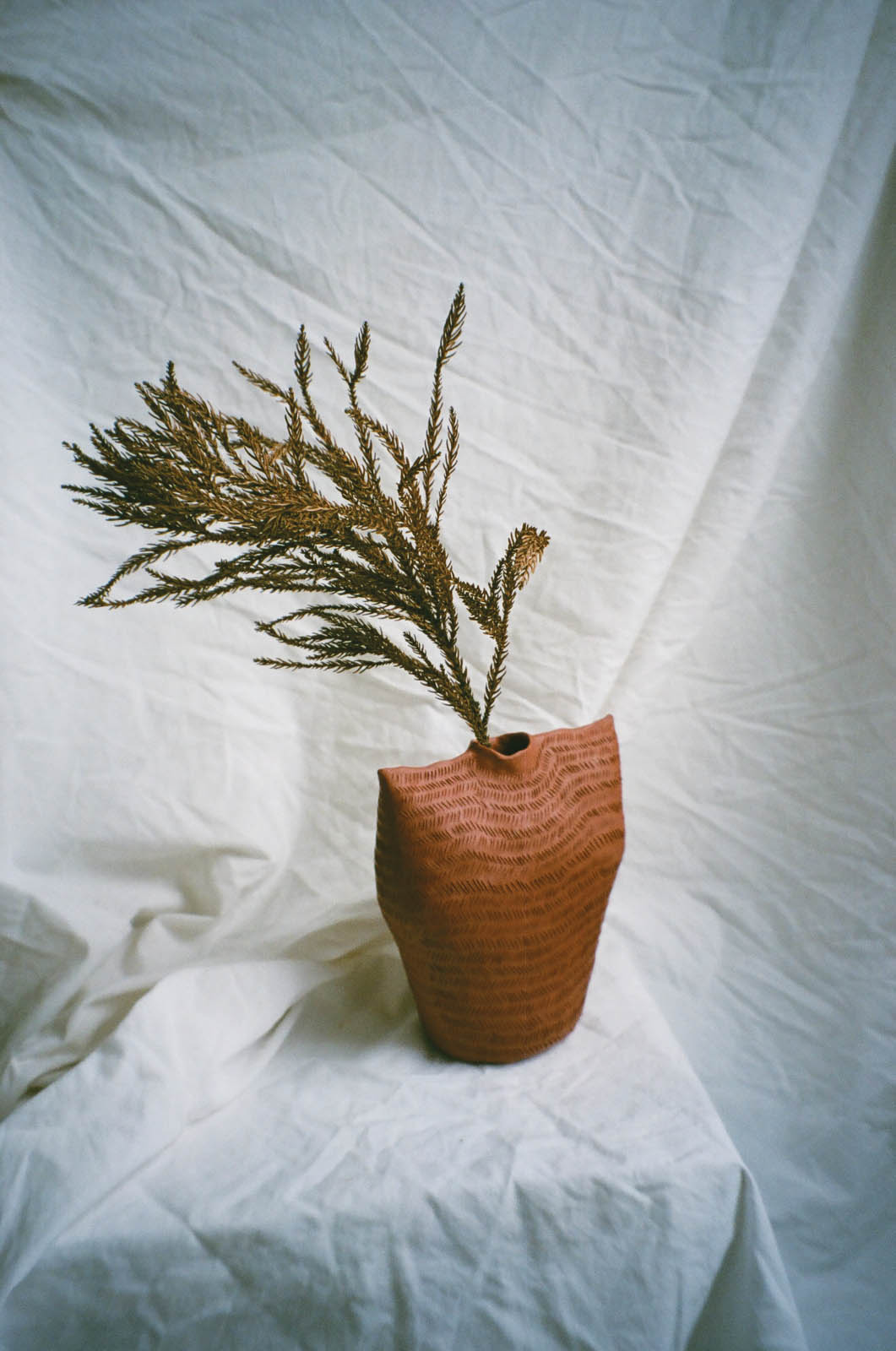 ceramic vase with leaves