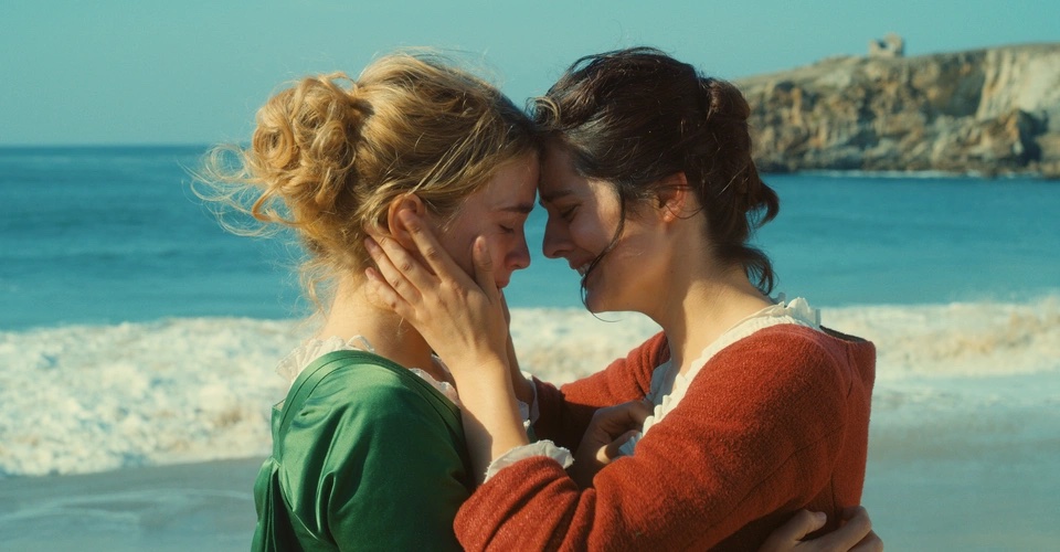 two women embrace with foreheads touching