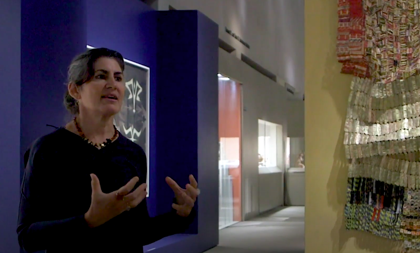 A woman speaking inside the MET Museum