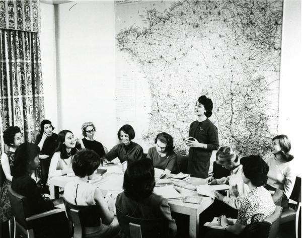 female professor instructs students