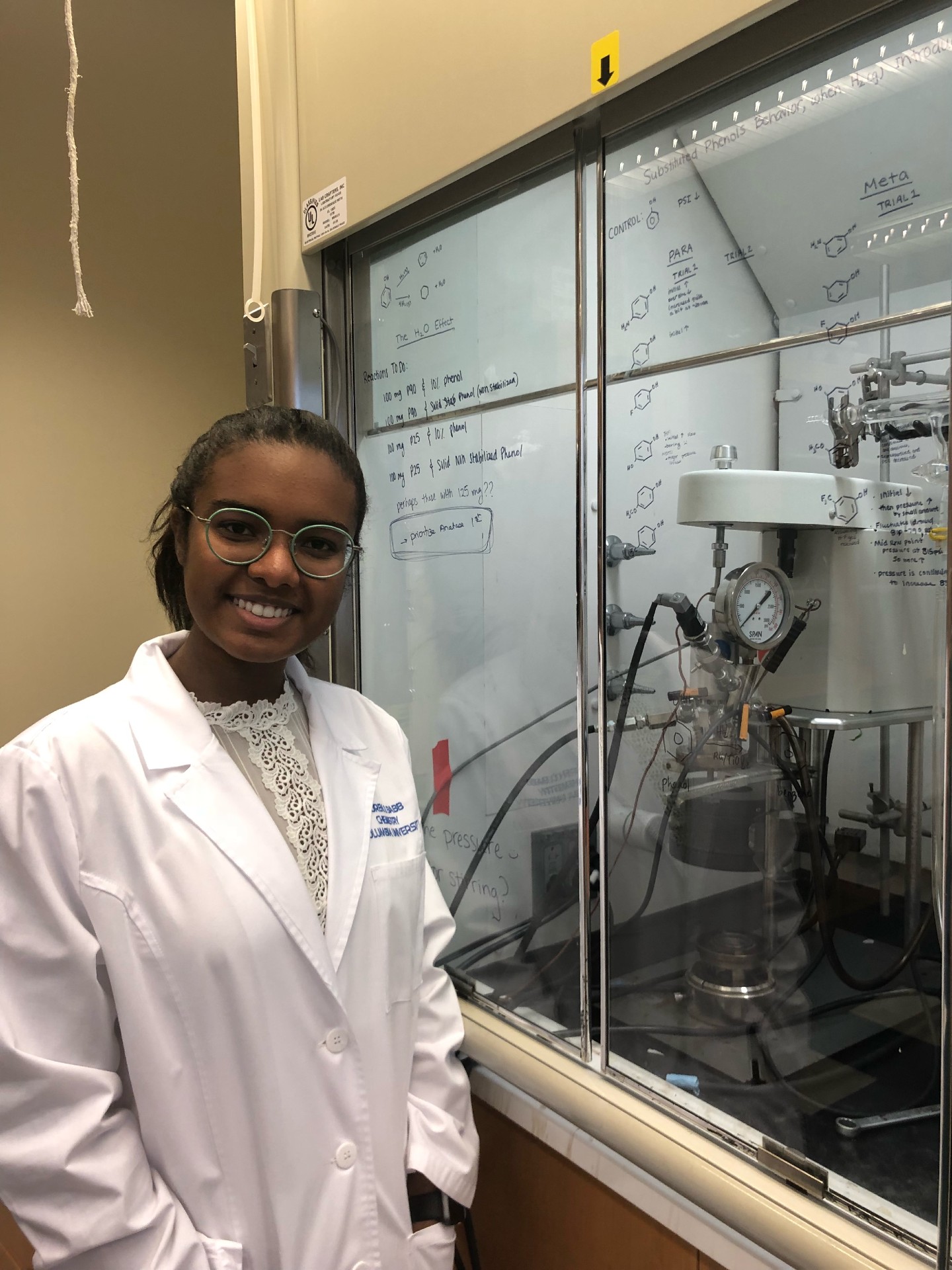 Lauren Babb wearing her lab coat in the lab