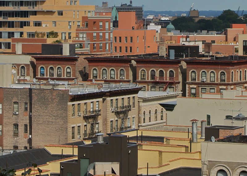 Rooftop view of buildings in Morningside Heights/Harlem with Hudson River in background