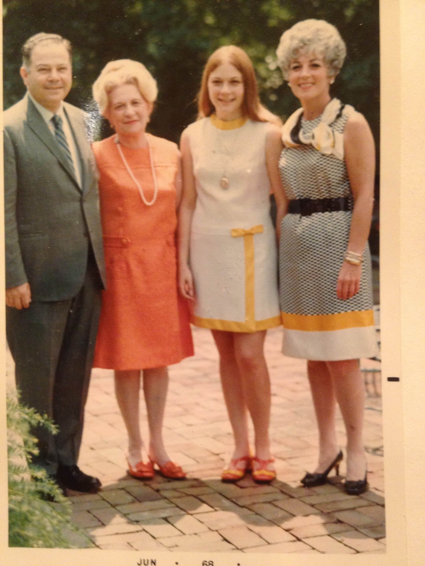 Elissa Newport in 1969 standing with 3 family members at graduation
