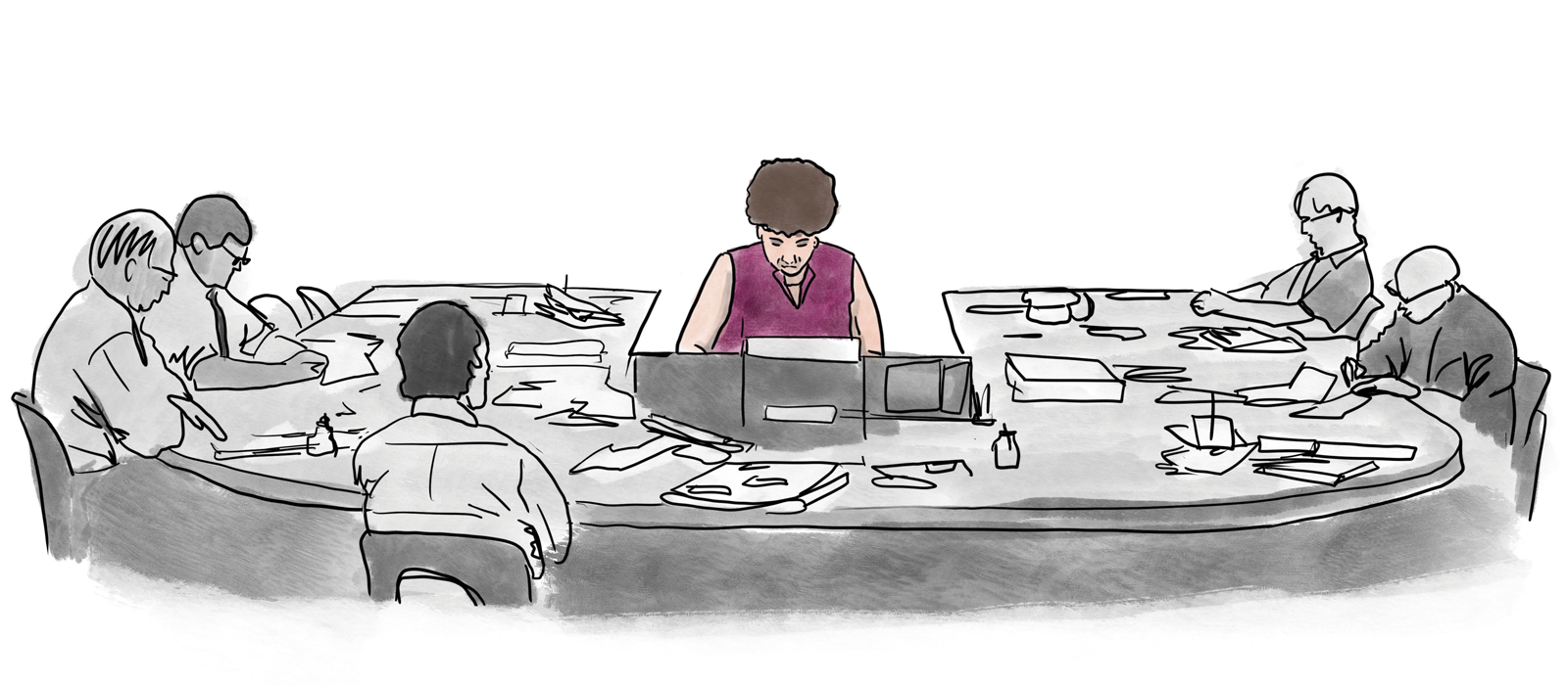 A woman working at a conference table