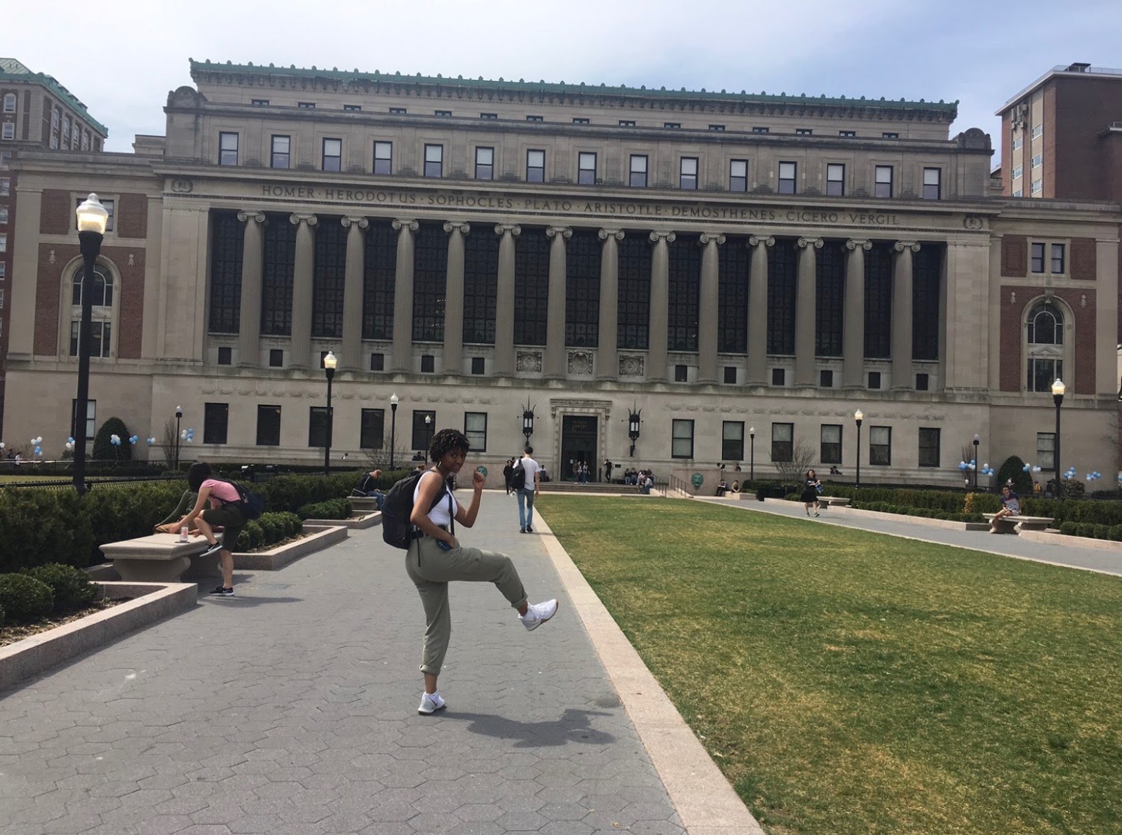Mia Flowers posing in front of Butler Library on the Columbia University campus.