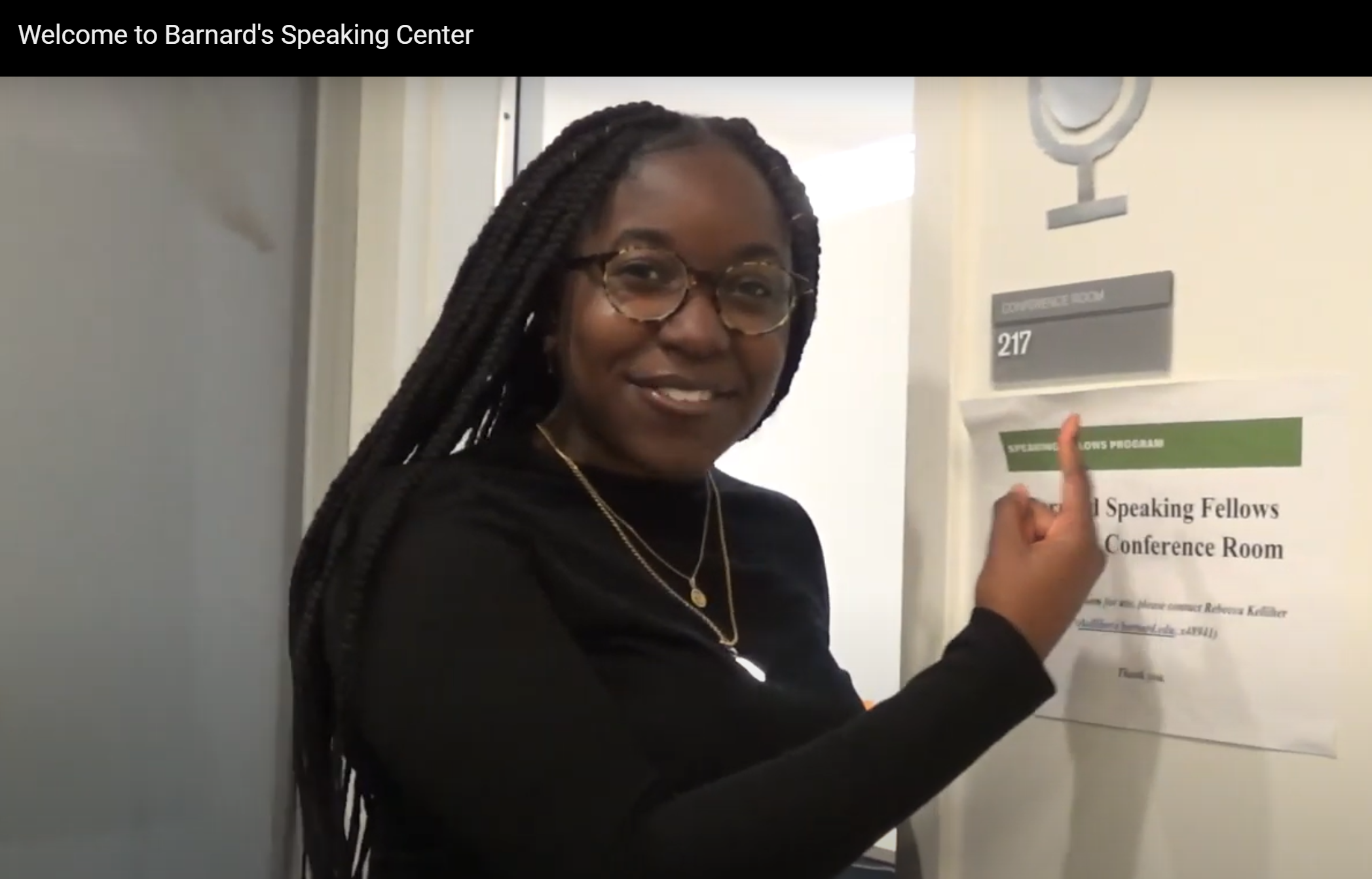 Speaking Fellow standing outside of Barnard 217