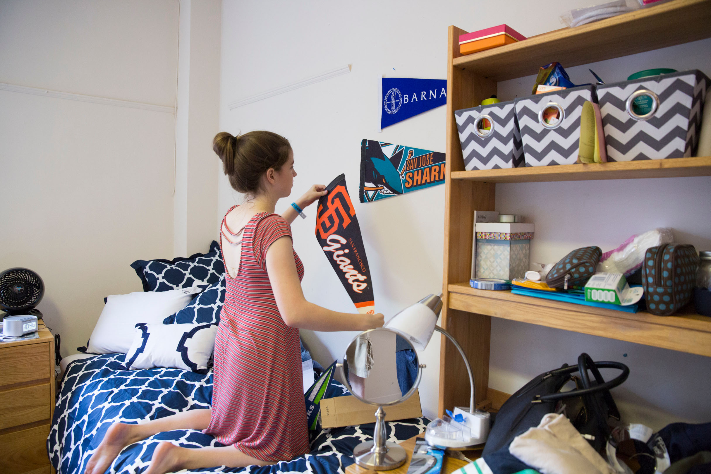 Student decorating dorm room