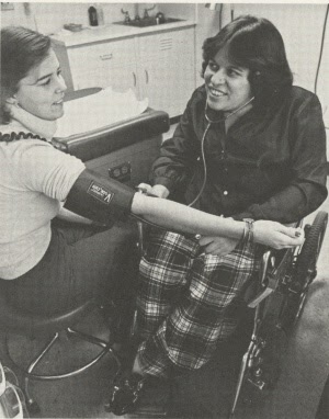 Dr. Laubenstein examining a patient.