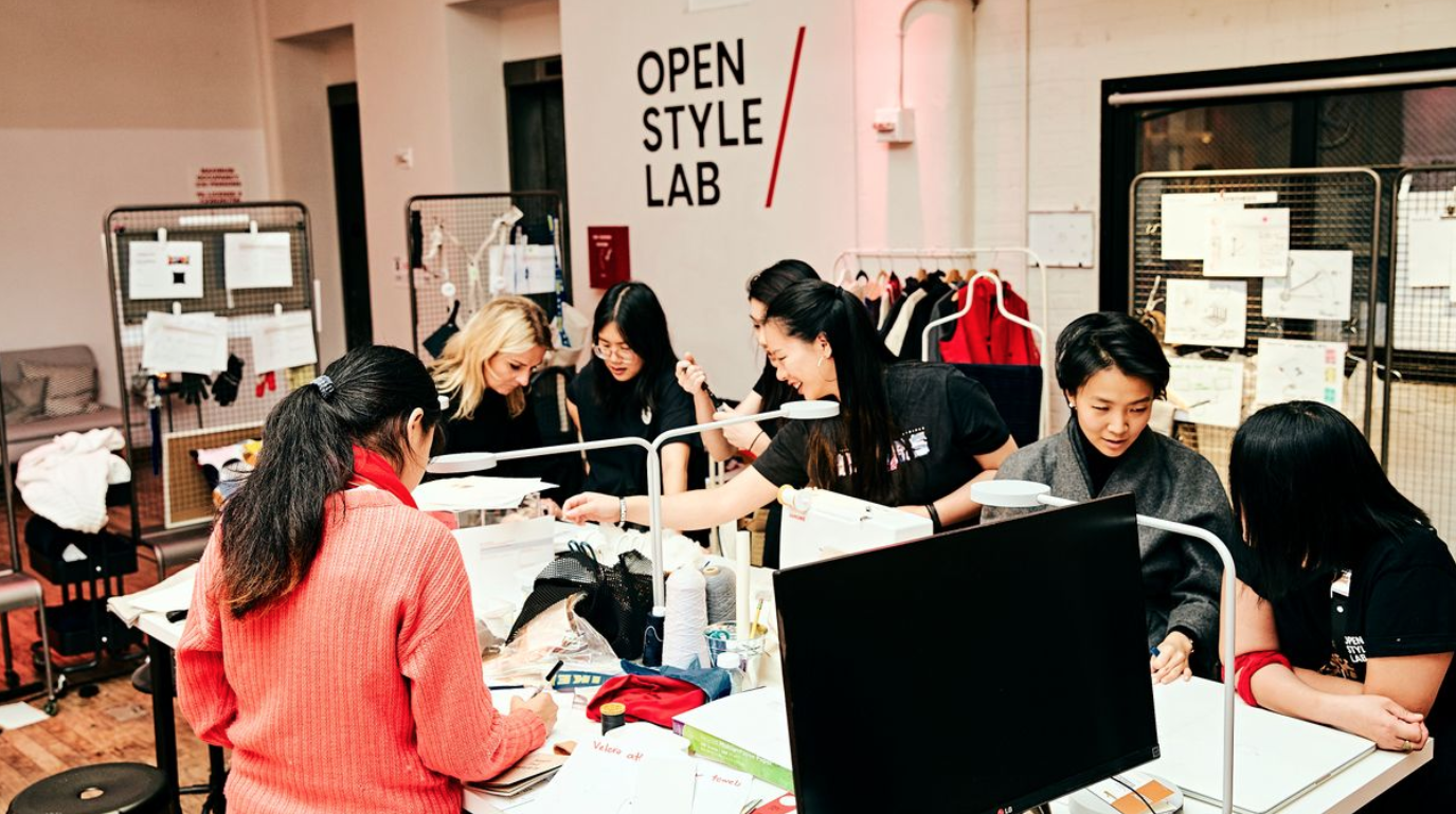 image of designers working in a design studio enviroment on fashion projects.