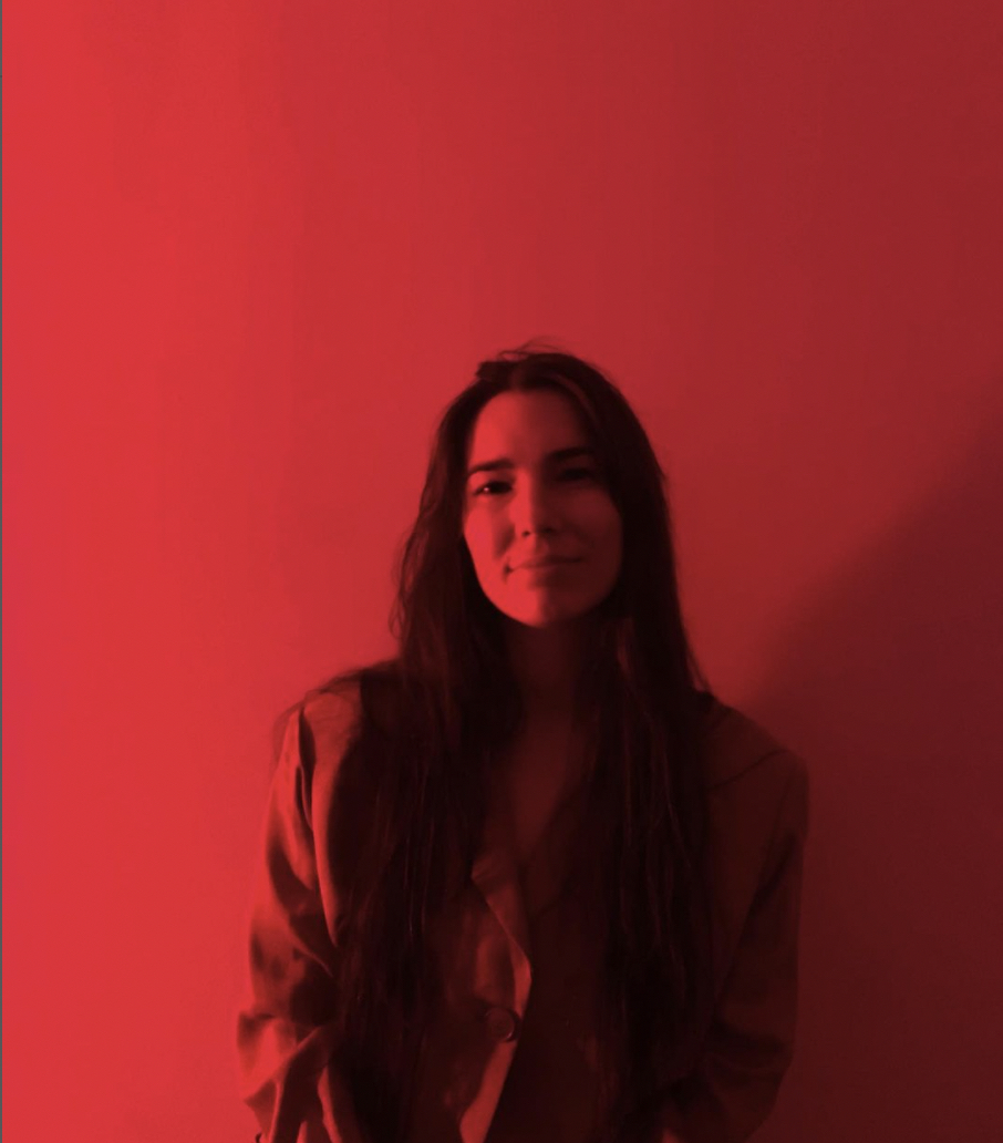 A headshot of Alexandria Giroux tinted red