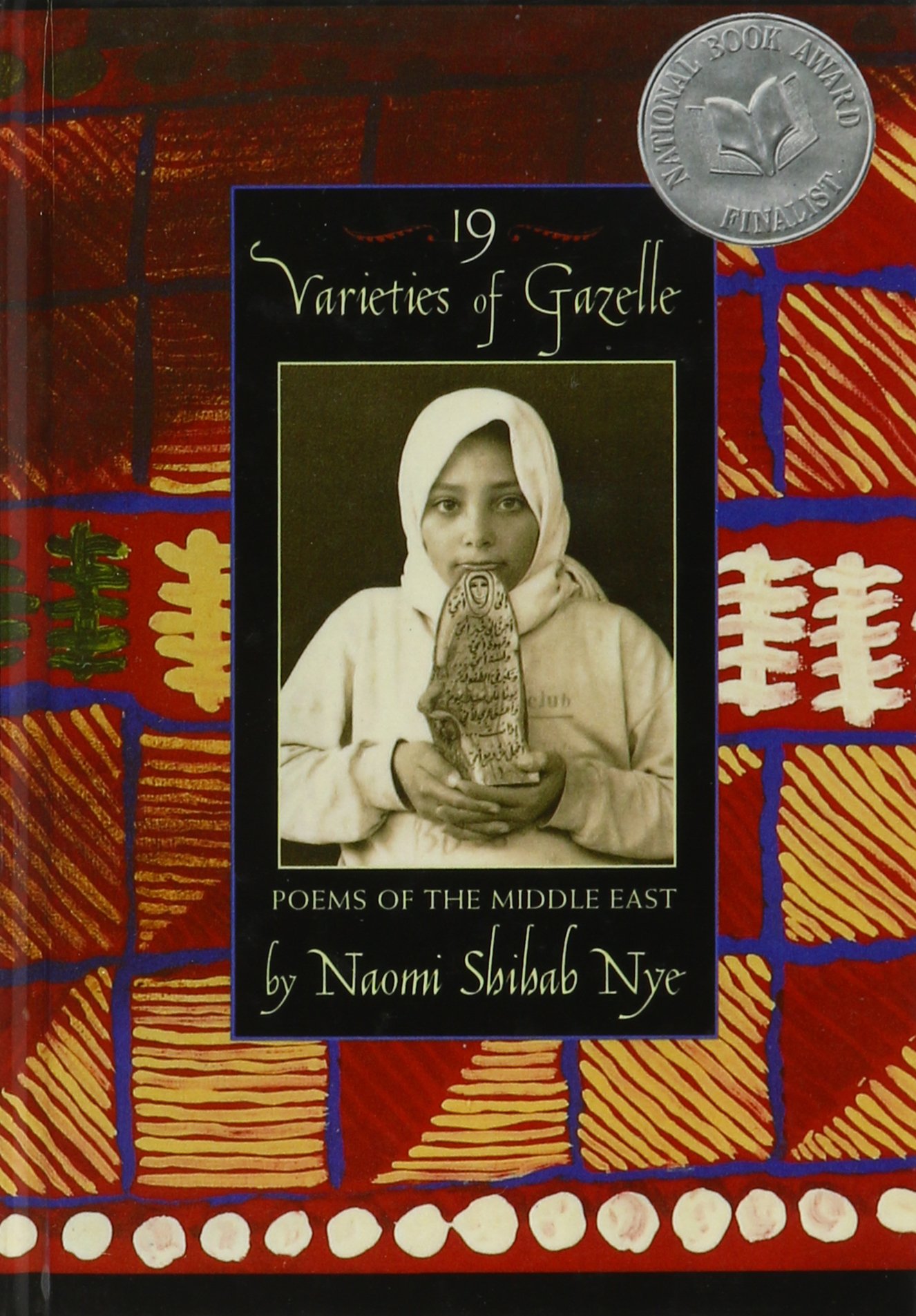 book cover featuring a girl in a headscarf holding something with arabic inscription on it 