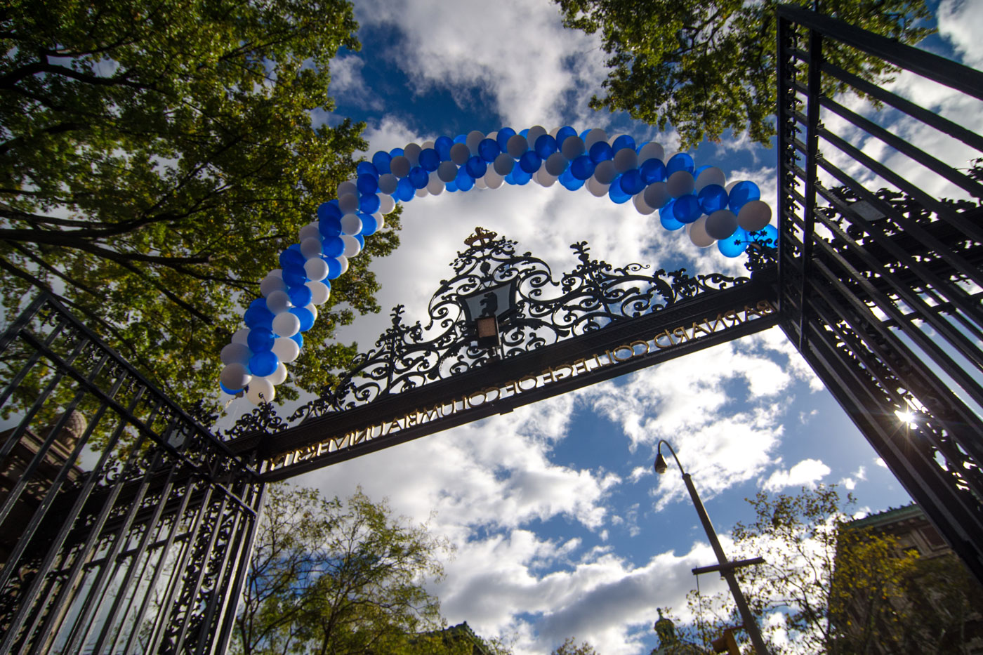 Barnard gate arch covered in white and blue balloons