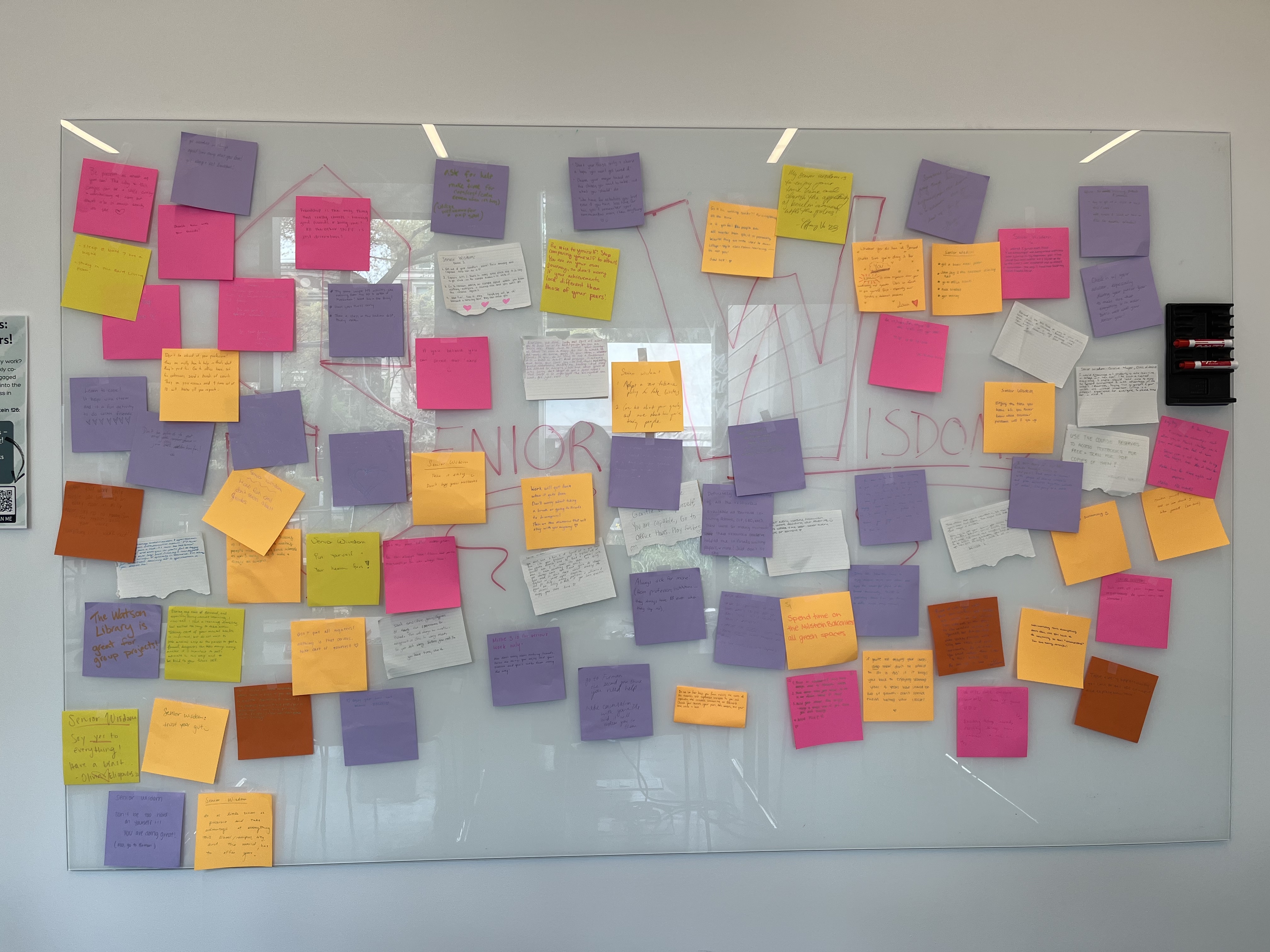 Image of colorful post-its on the Center for Engaged Pedagogy white board. On each white board is a piece of advice from a graduating senior in the class of 2022.