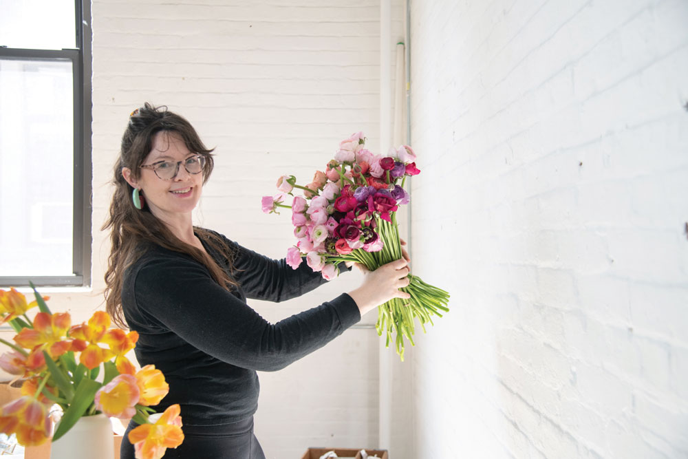 Image of Molly Culver holding flowers