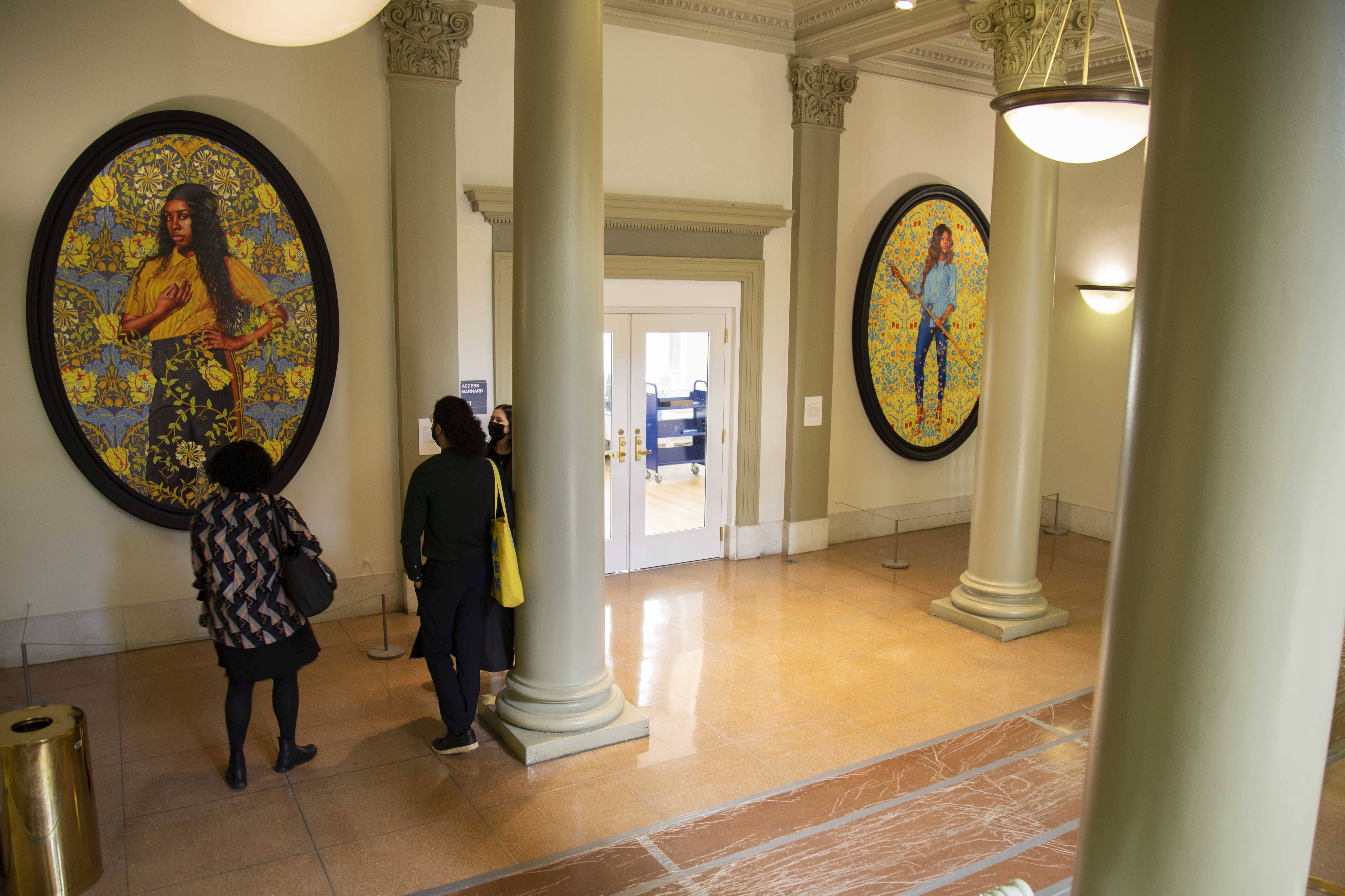 Wide shot of Kehinde Wiley portraits in Milbank Hall