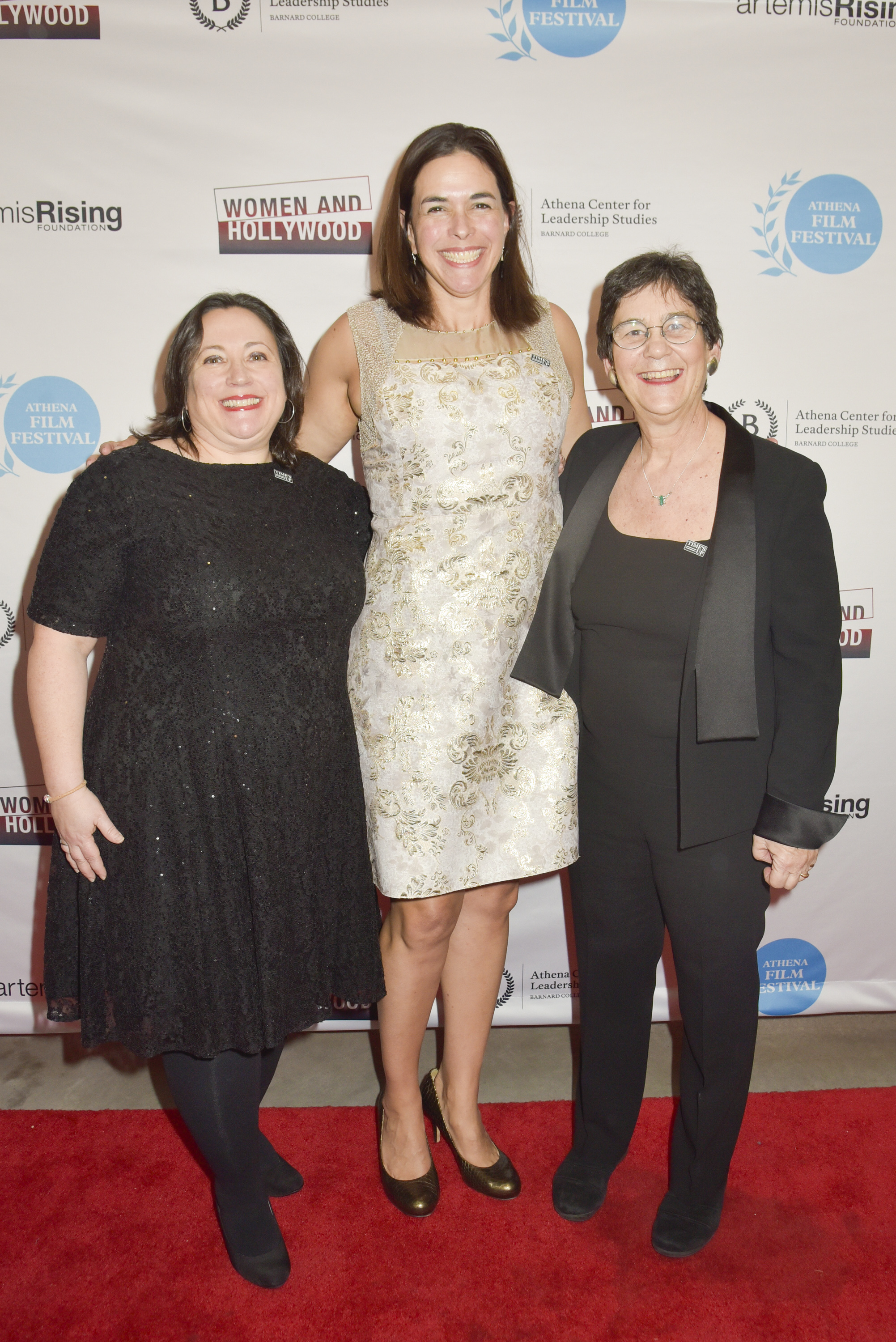Melissa Silverstein, Sian Beilock and Kathryn Kolbert stand in front of a branded backdrop