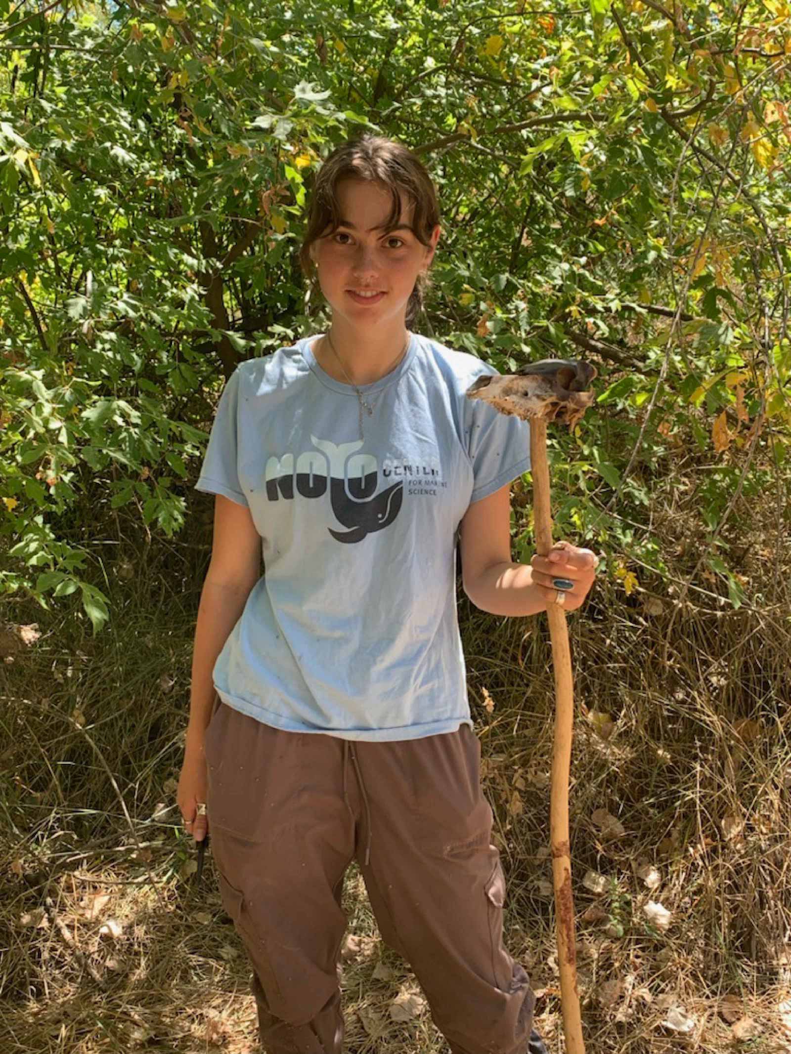 Lily Davenport with a walking stick with a skull on it