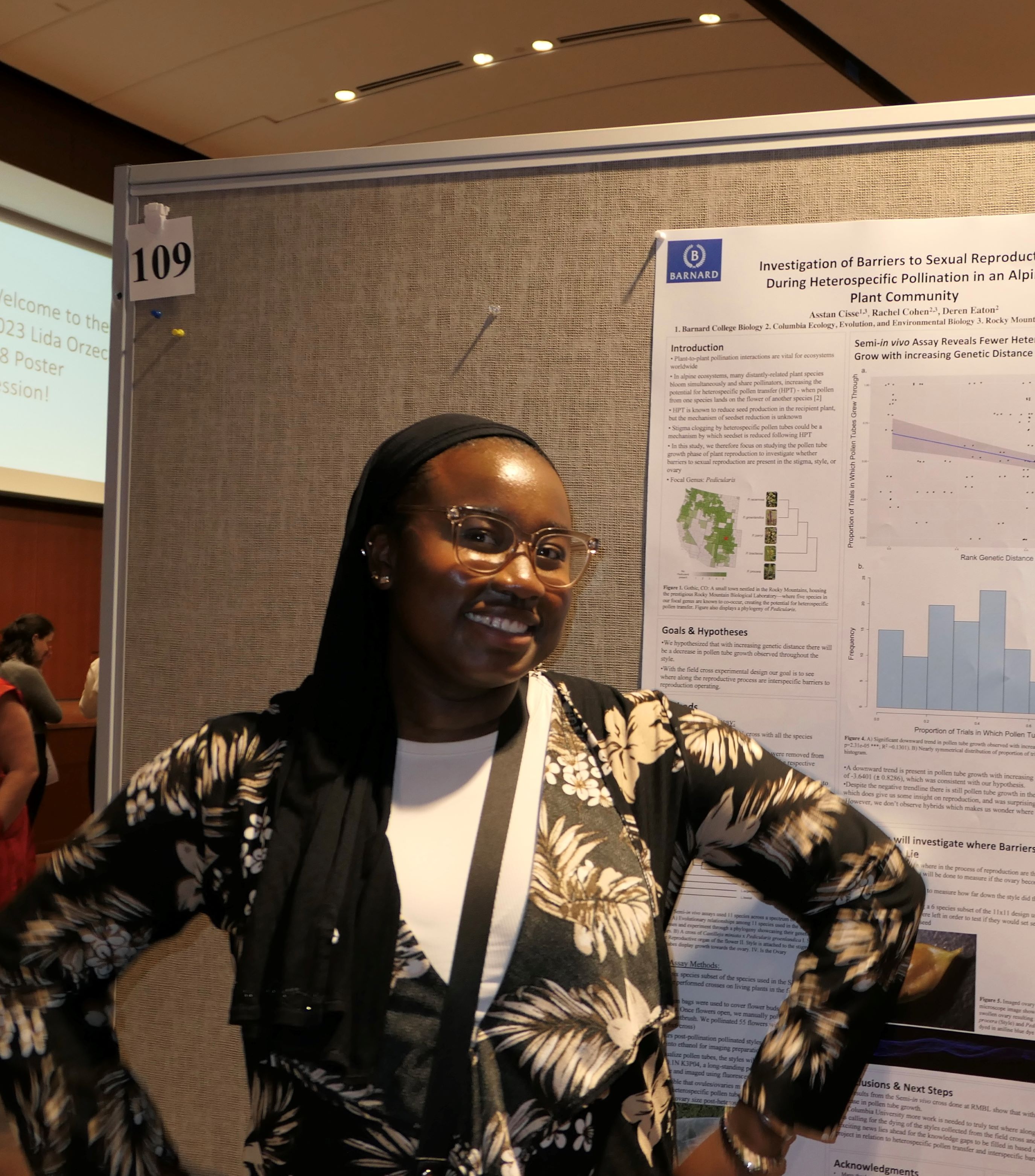 Asstan Cisse presenting her poster at a poster session