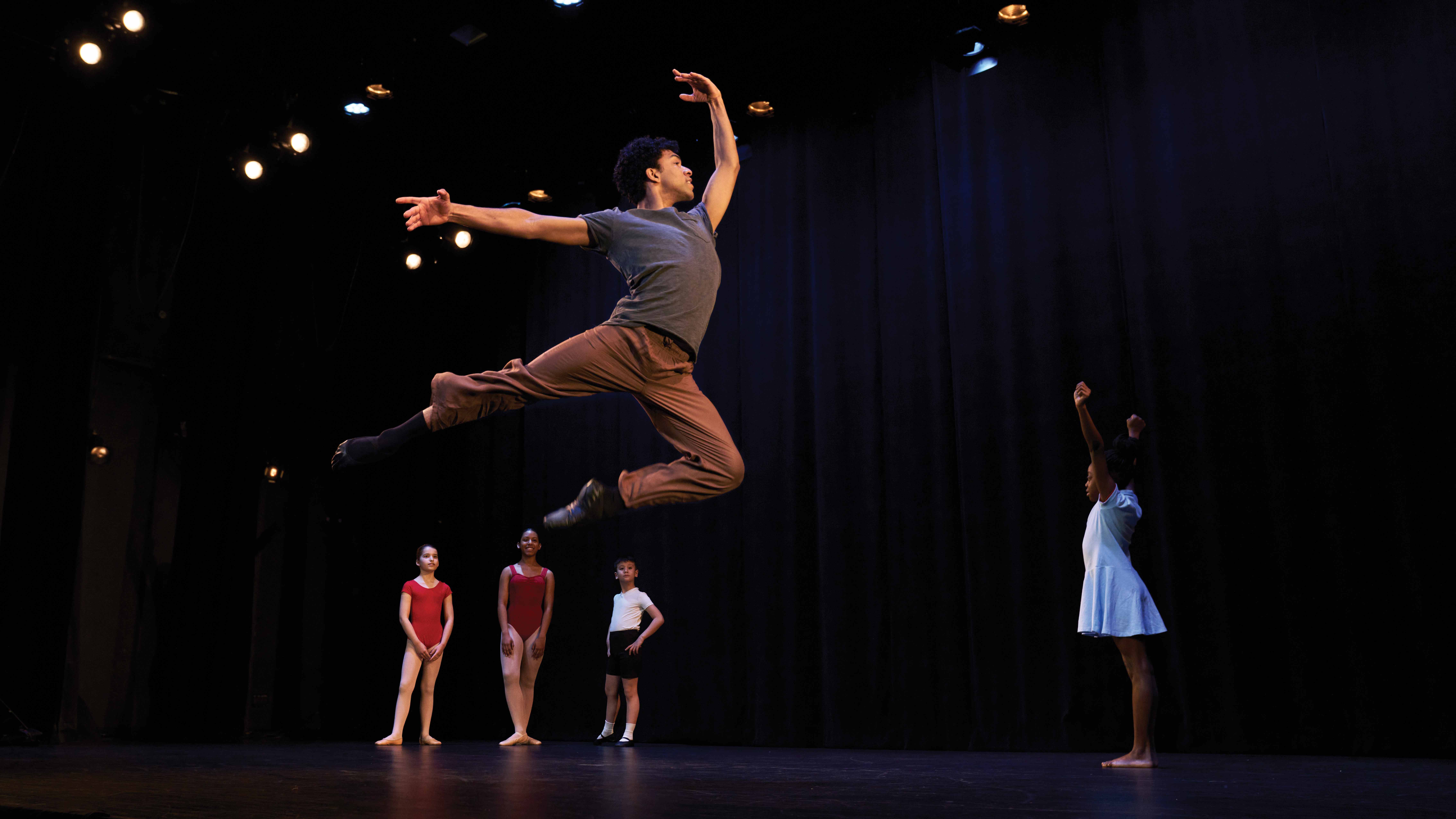 Image of young man leaping in dance
