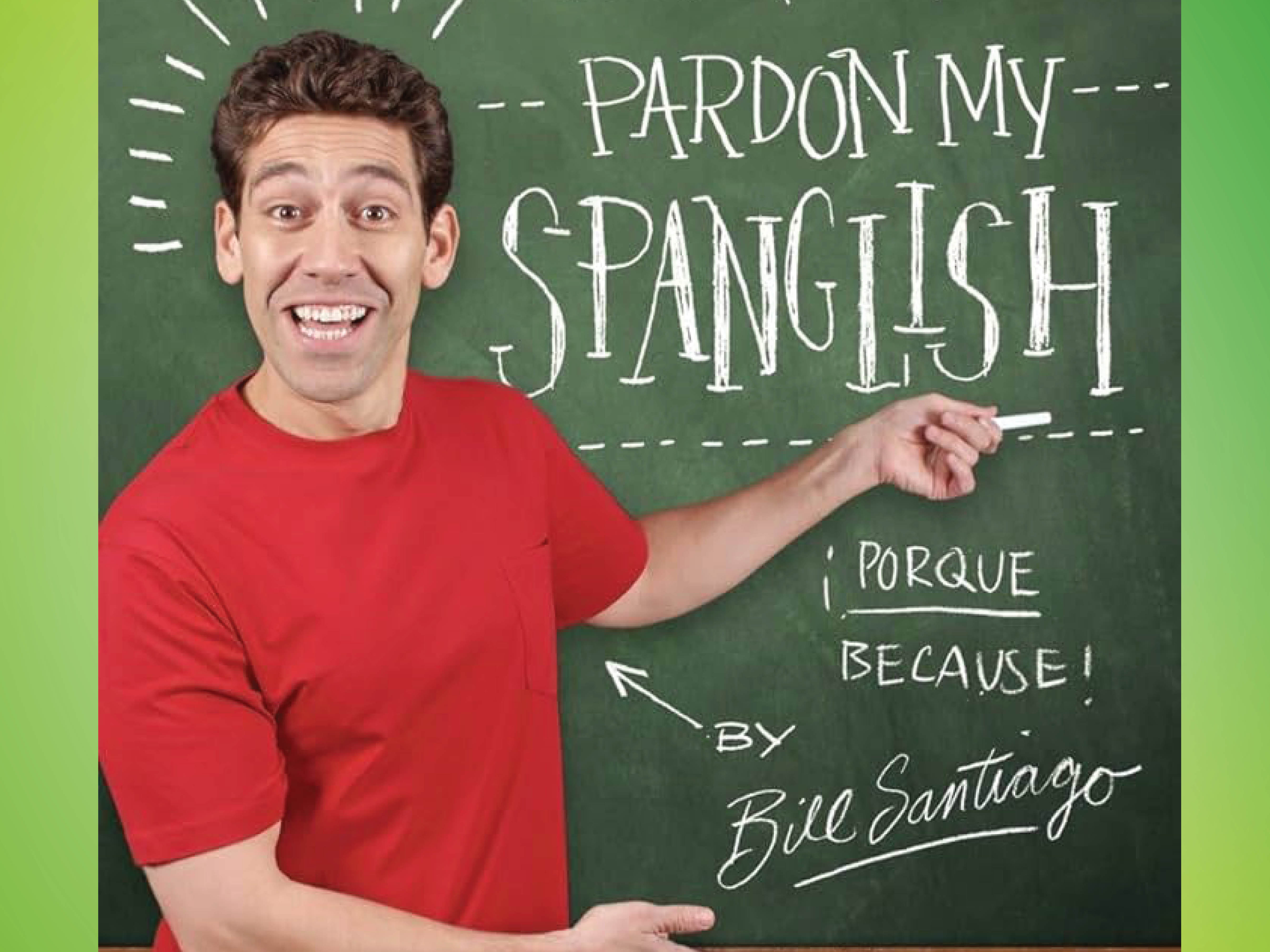 comedian Bill Santiago pointing to "pardon my spanglish" written on a chalkboard