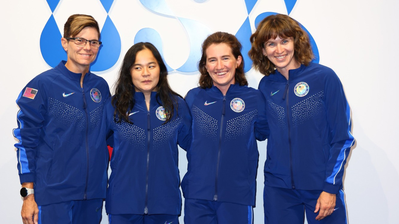 Four women wearing blue on Team USA Tandem cycling