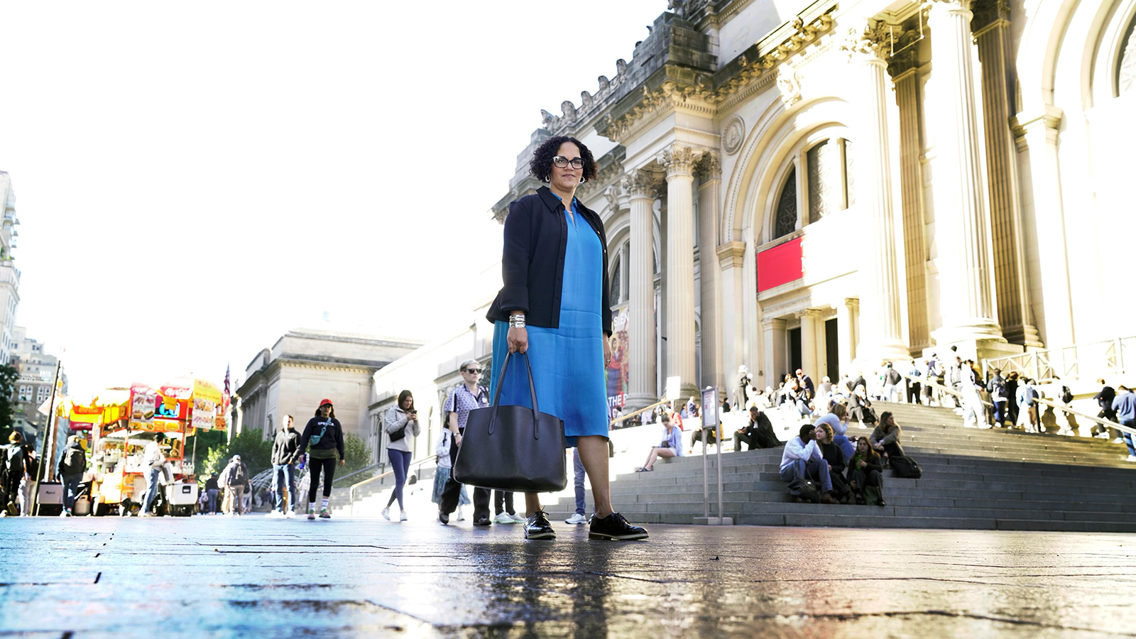 Miller walking in front of the Met museum in NYC