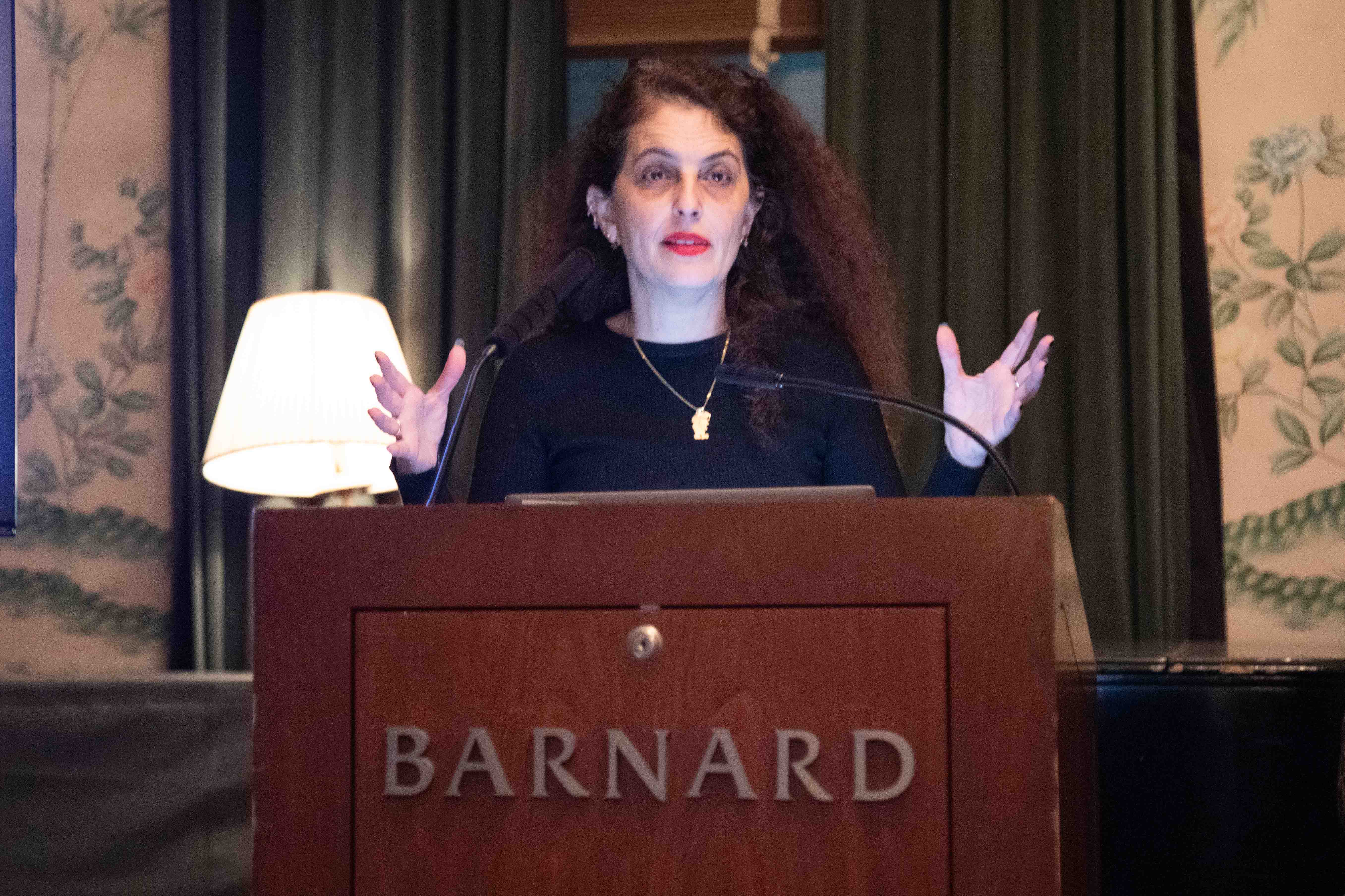 Woman standing at Barnard podium