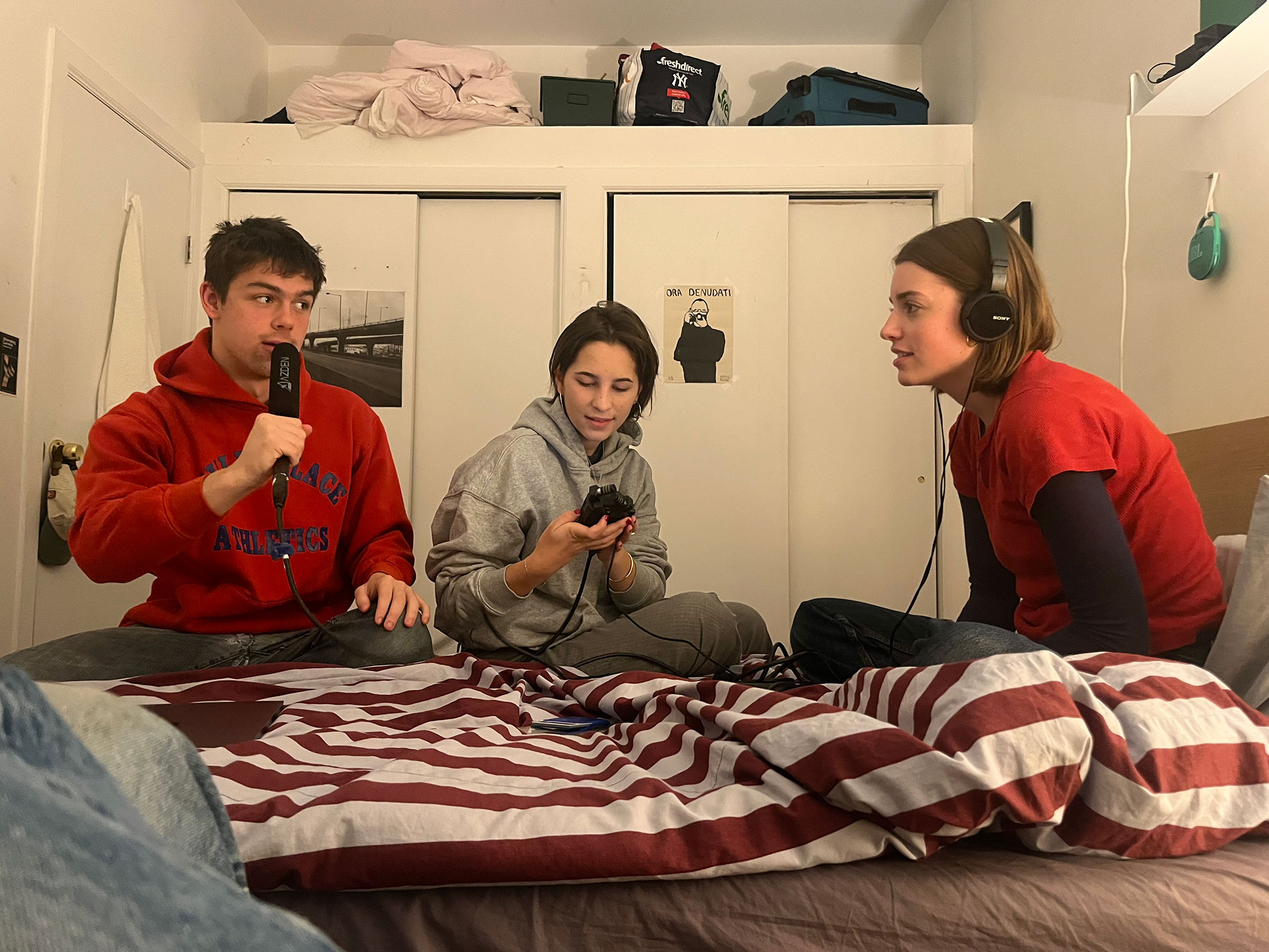 Three people in room with recording materials