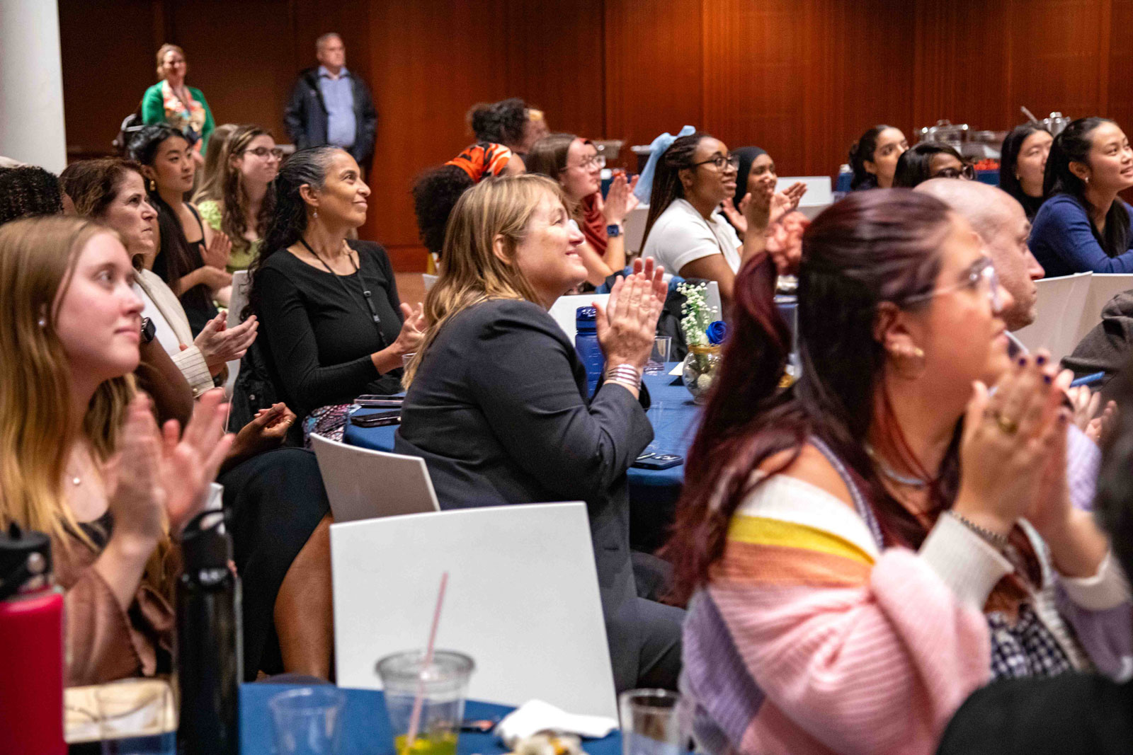 Audience shot people clapping
