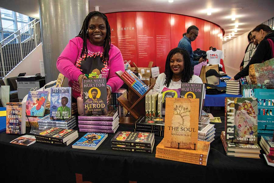 Women at Zora summit sell books