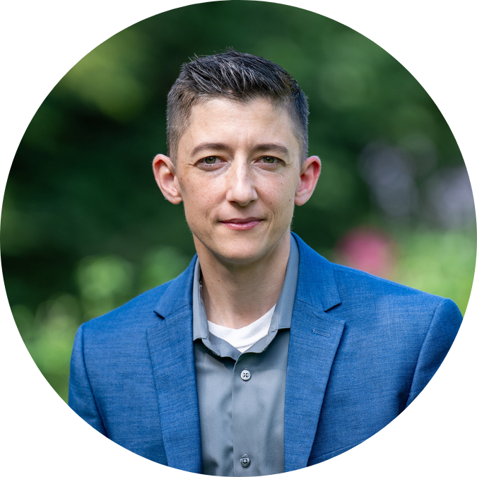 Perry Zurn wears a blue suit and looks directly at the camera.