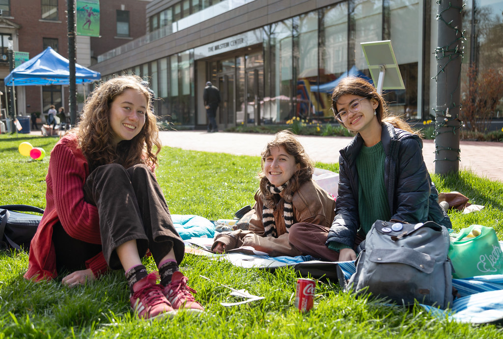 students sitting outside