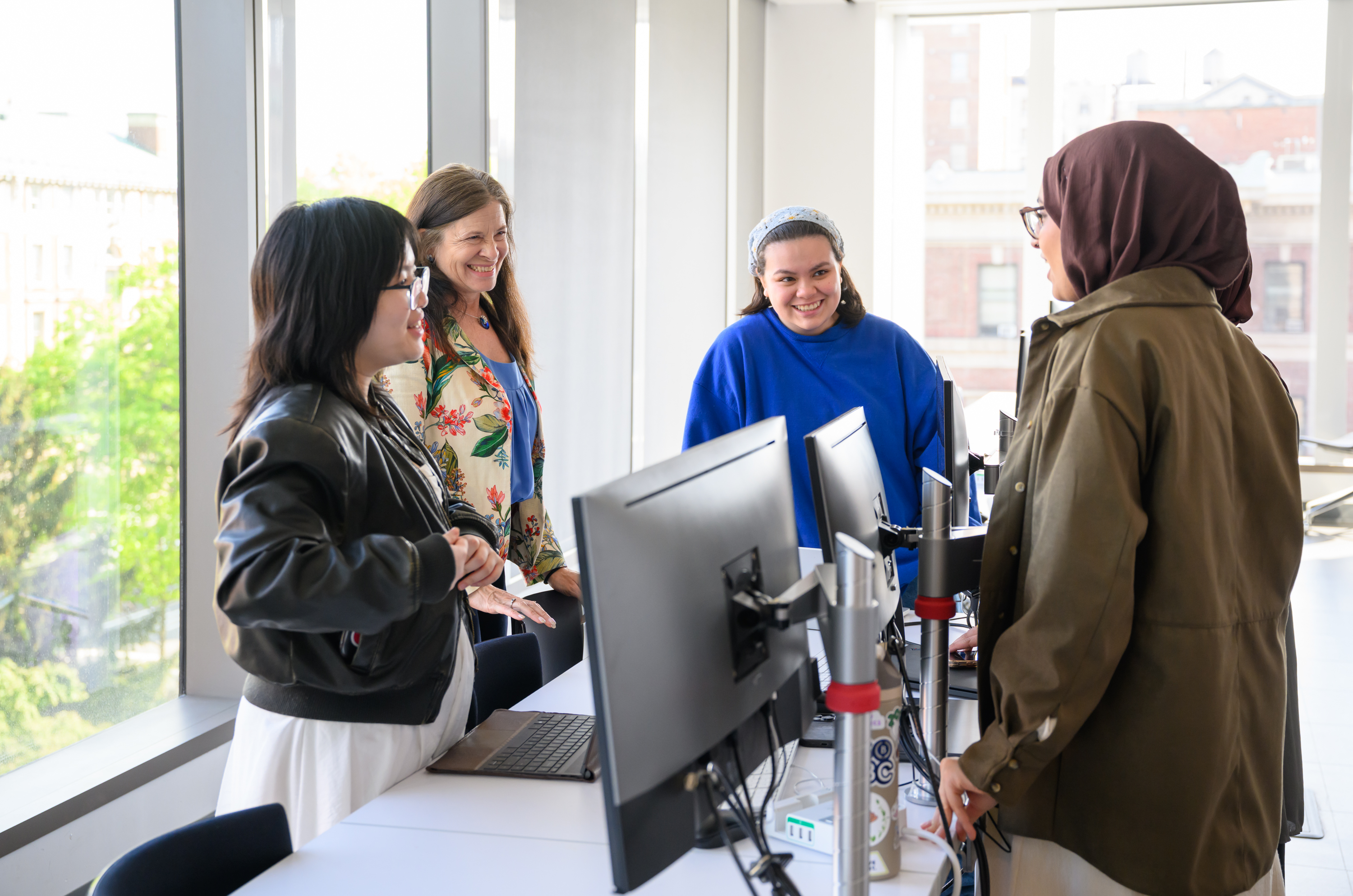 Students by a computer