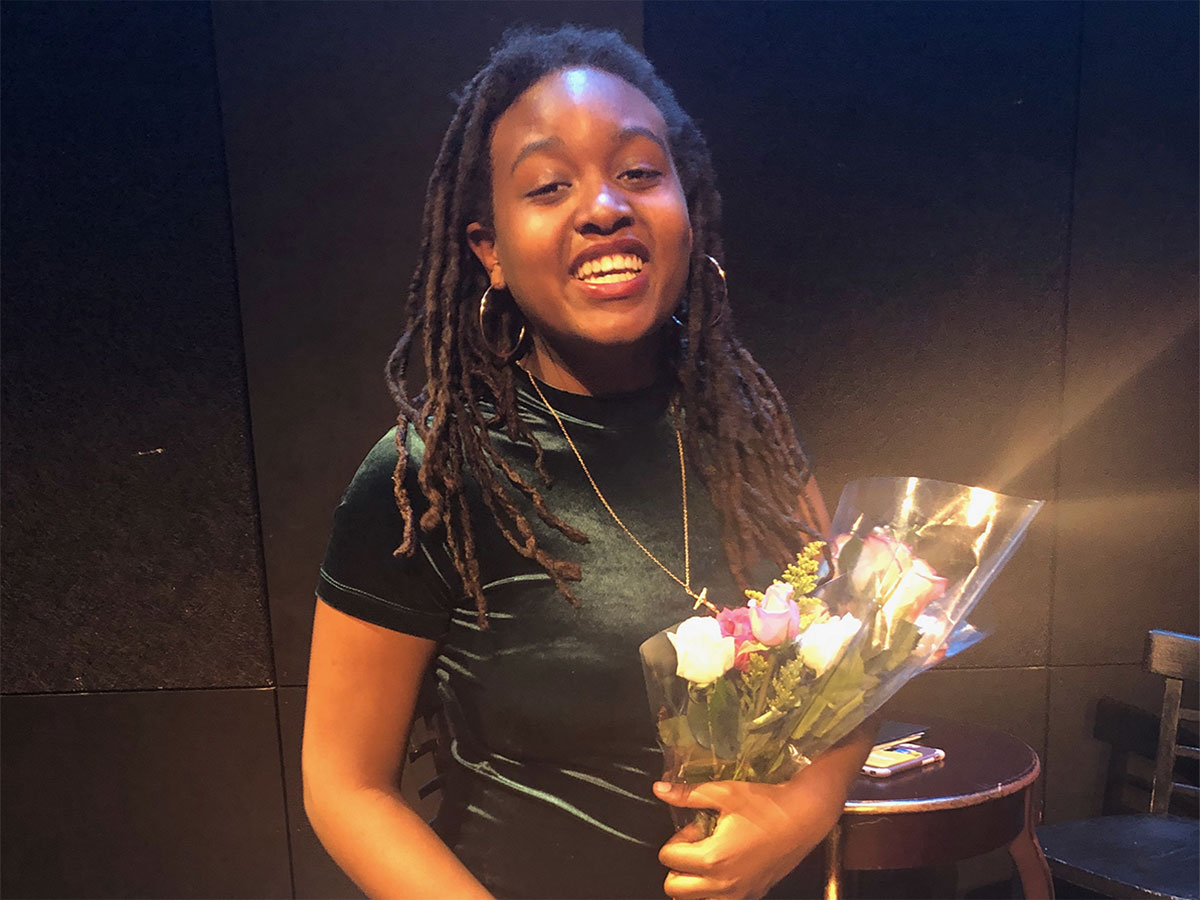 Young woman holding bouquet of flowers