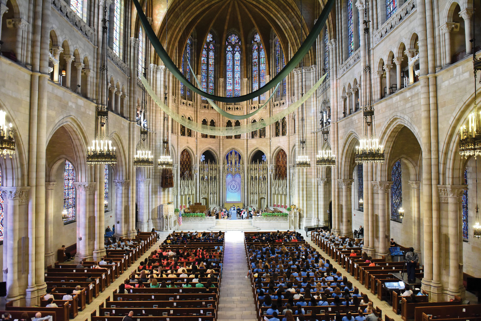 Interior church with students and faculty and staff members
