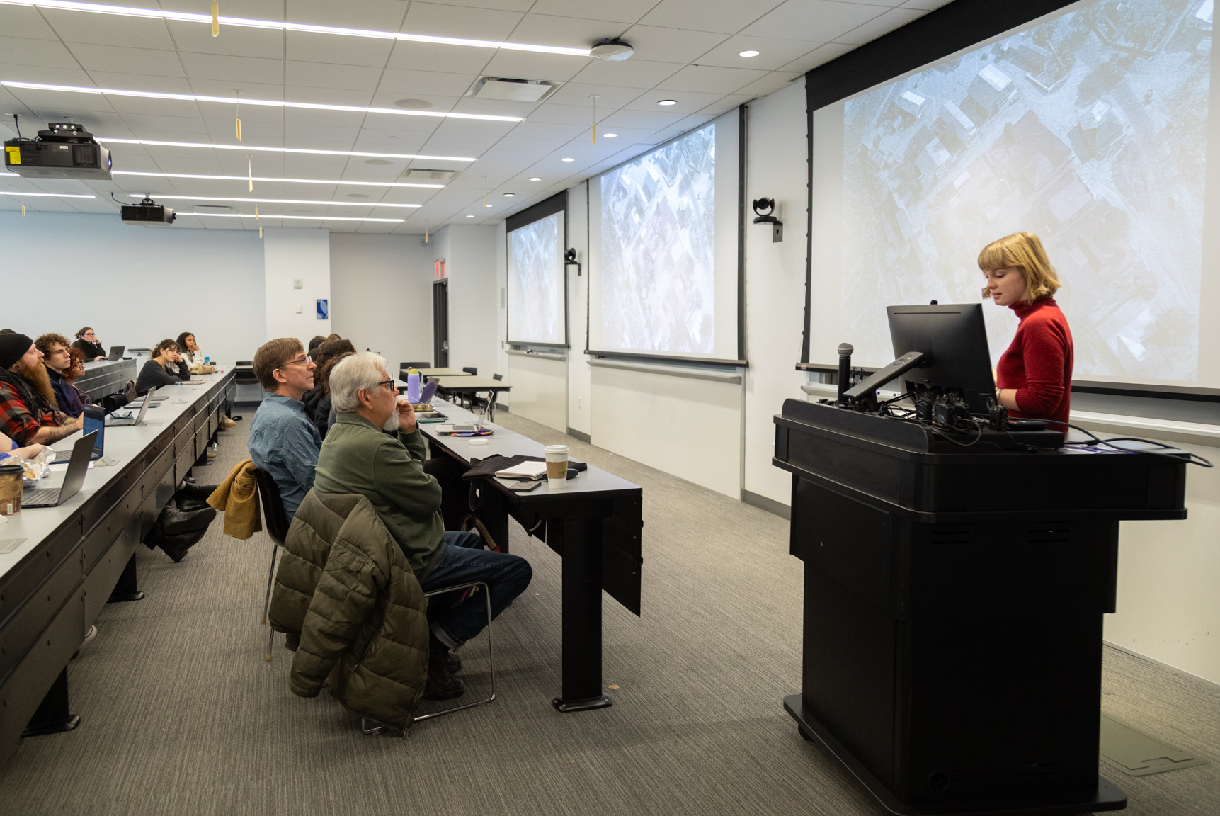 Student presents findings in front of Levi Romero.