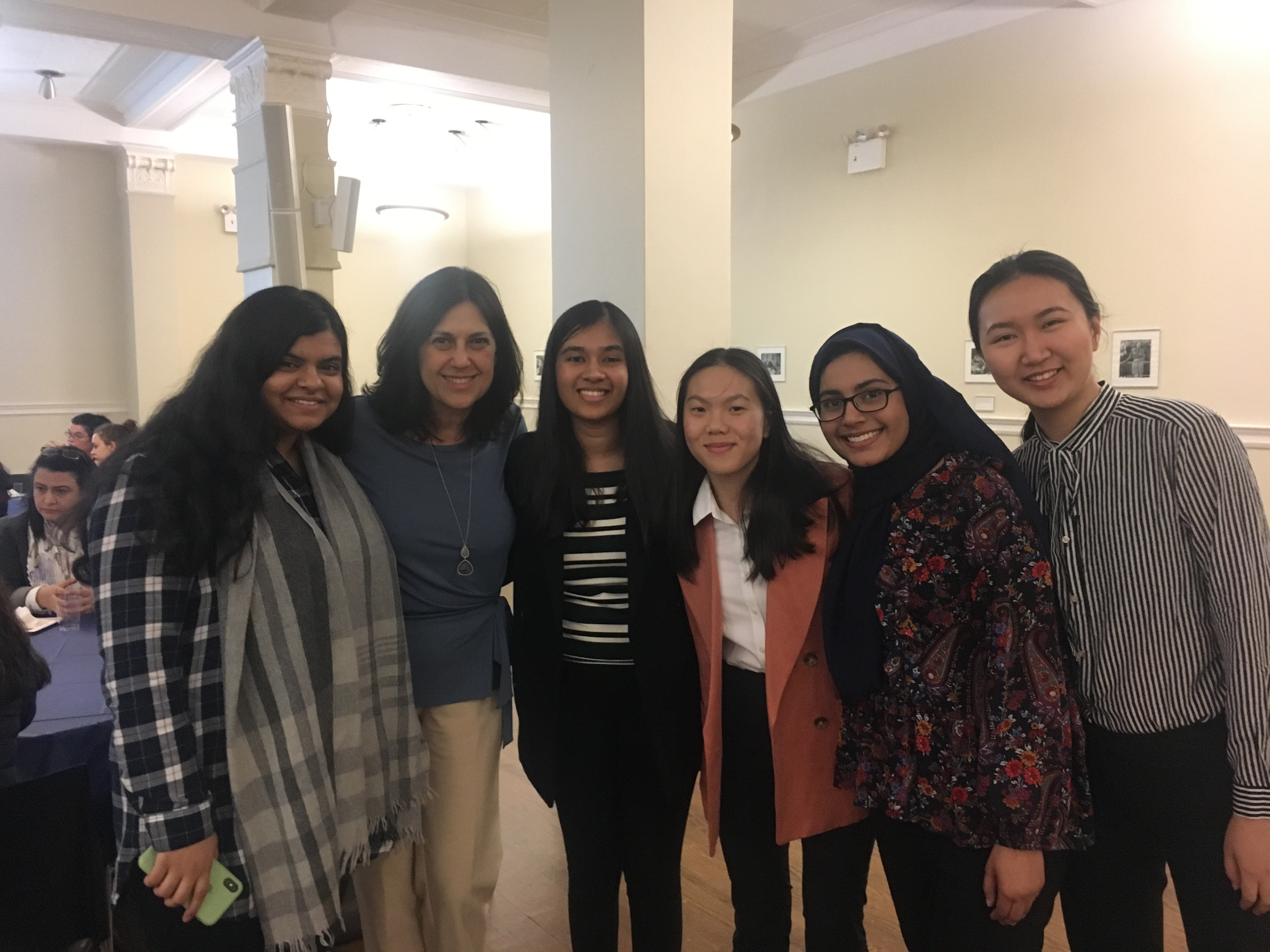 Group of students and alumnae at a health professions event.