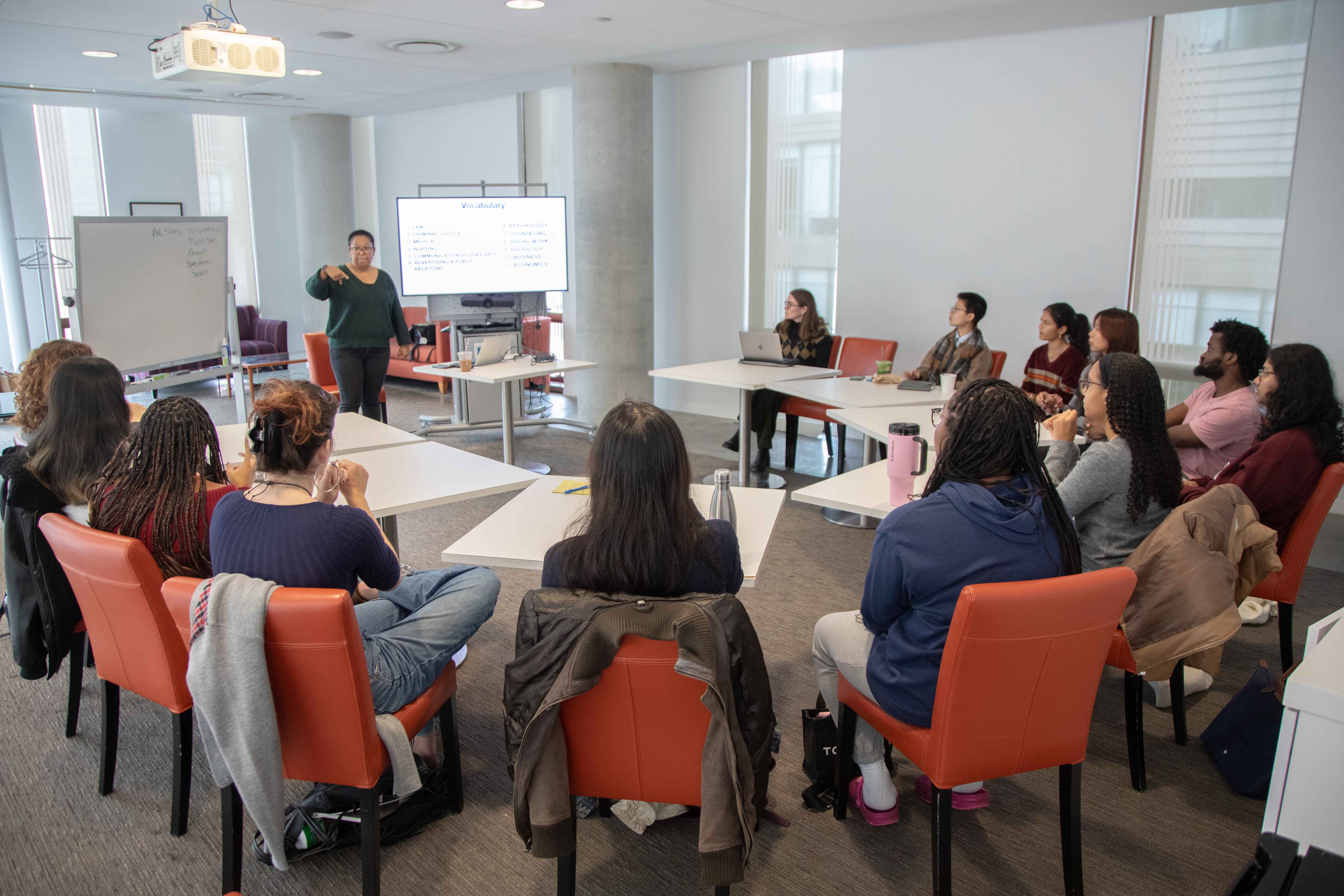 Professor Aaron-Lozano instructing ASL class.