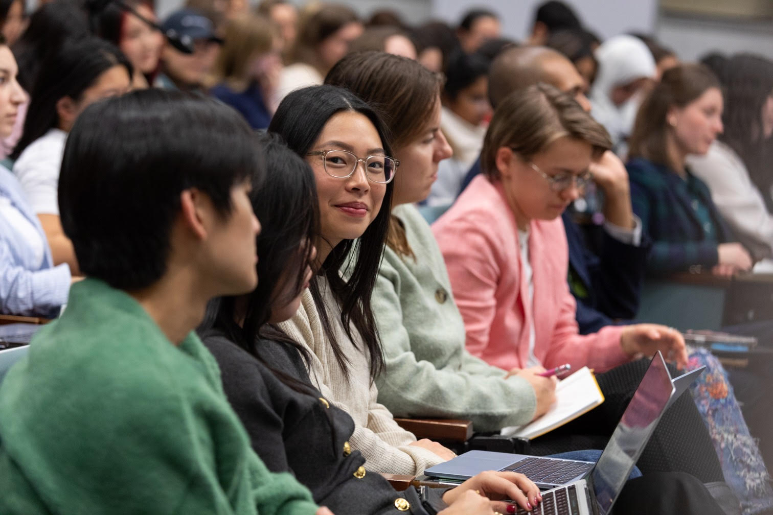 Megan Chui sitting in audience. 