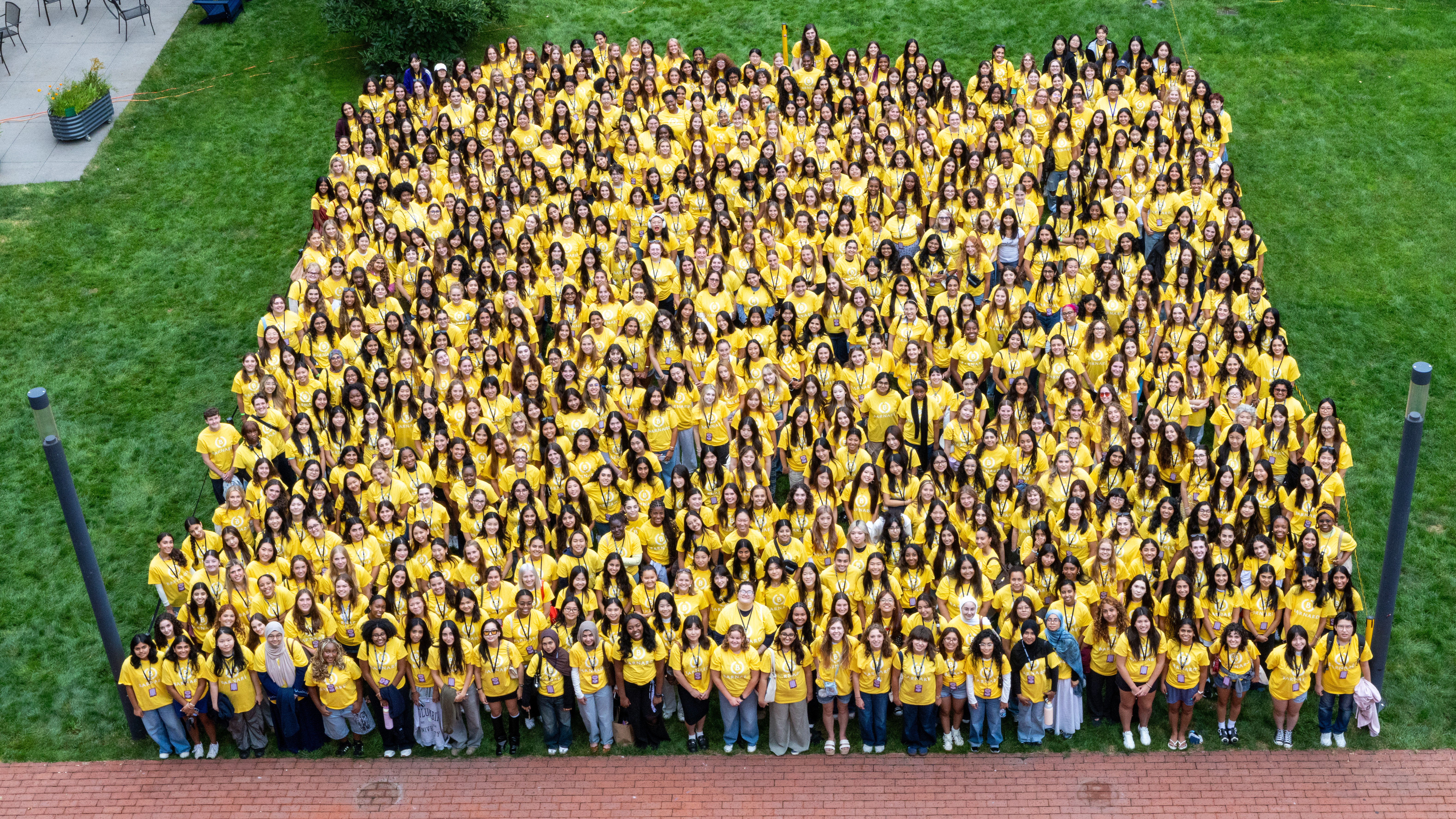 Group of students in yellow tee-shirts.