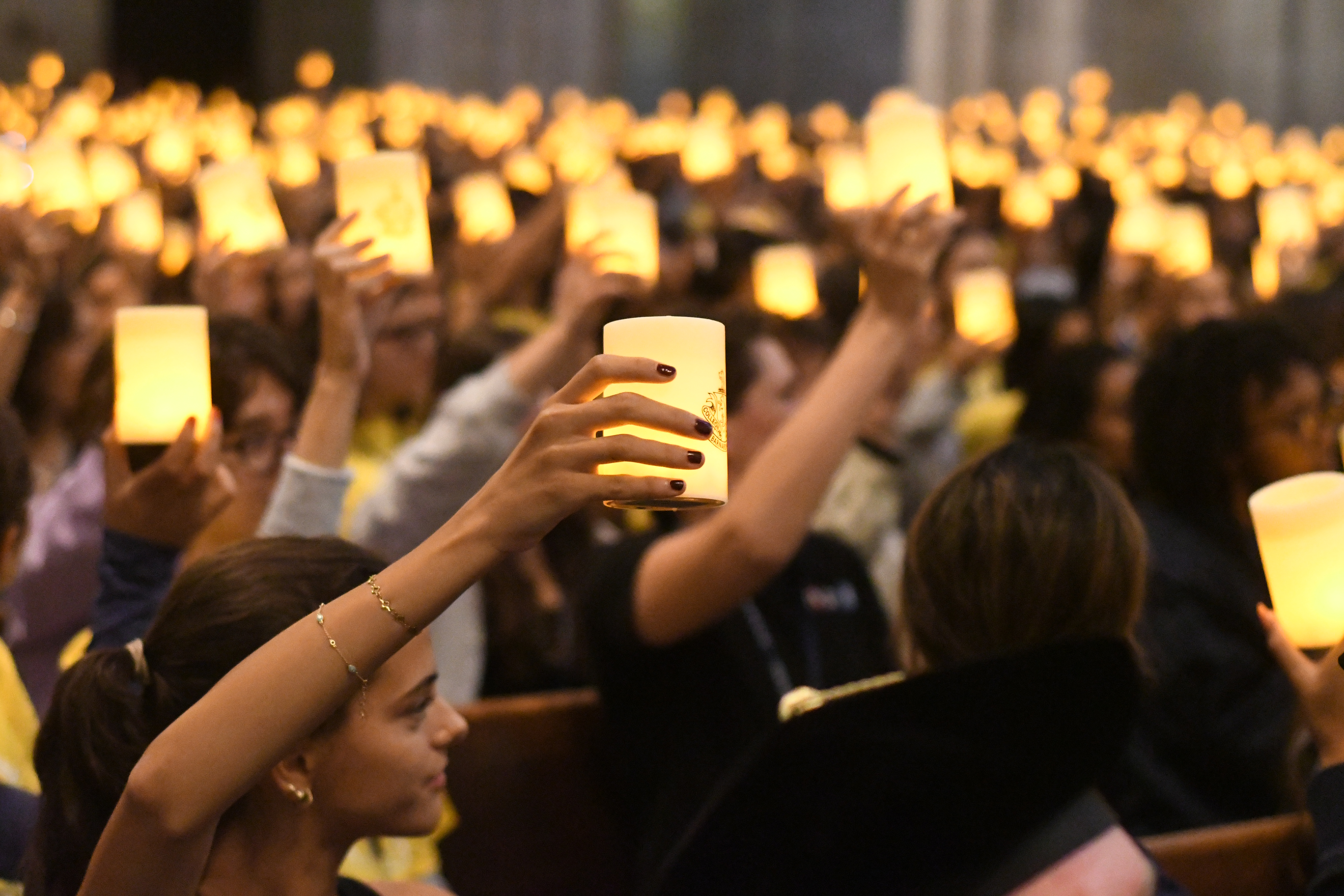 Hands with candles.