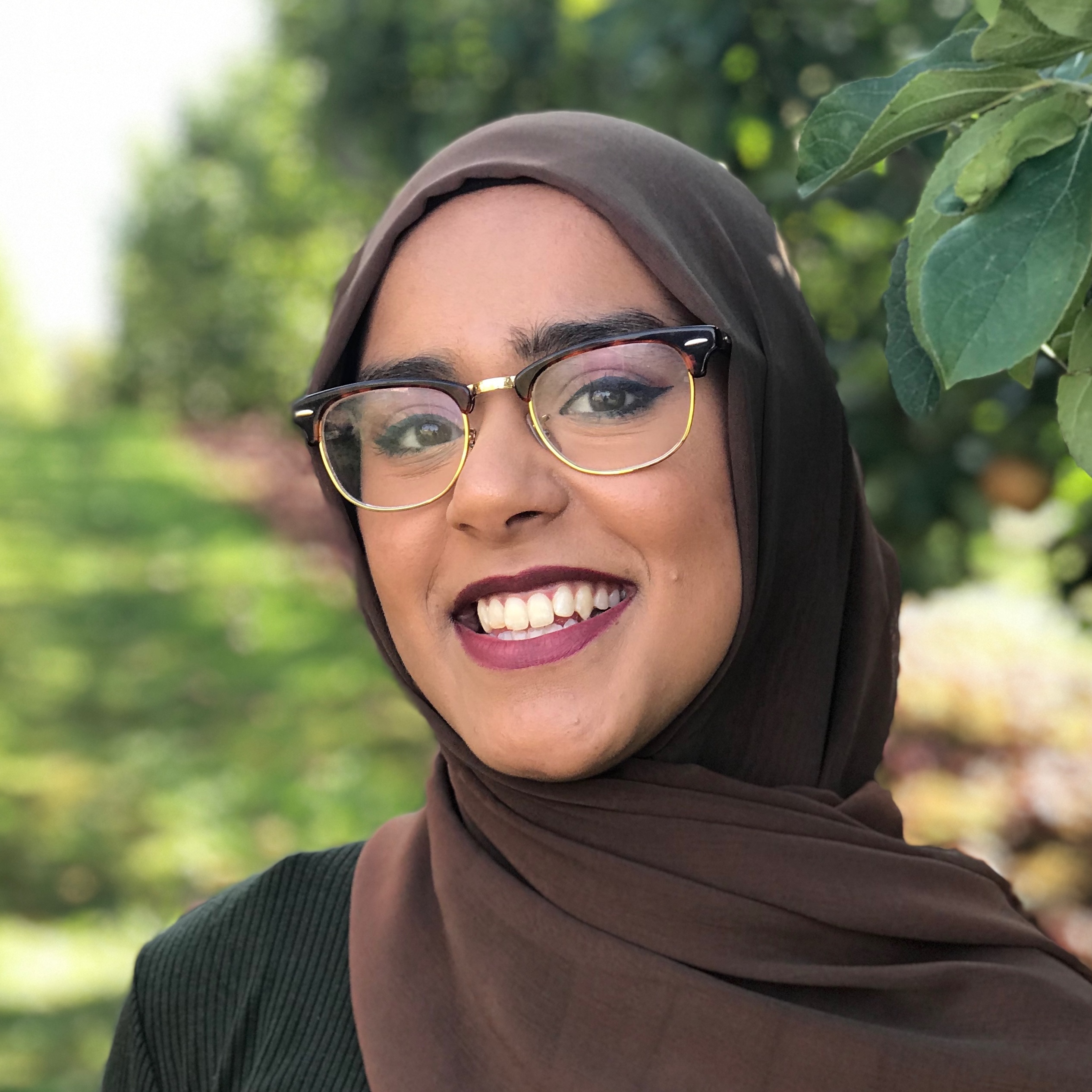 girl in brown hijab smiling