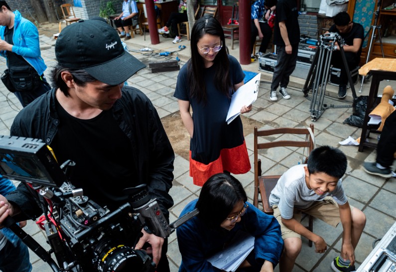 Iris Sang on location in Beijing, filming "Qinton." 