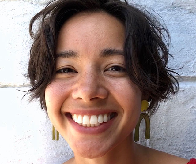 Young woman with short dark hair.