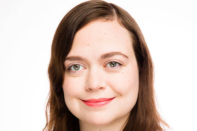 Young white woman with brown hair.