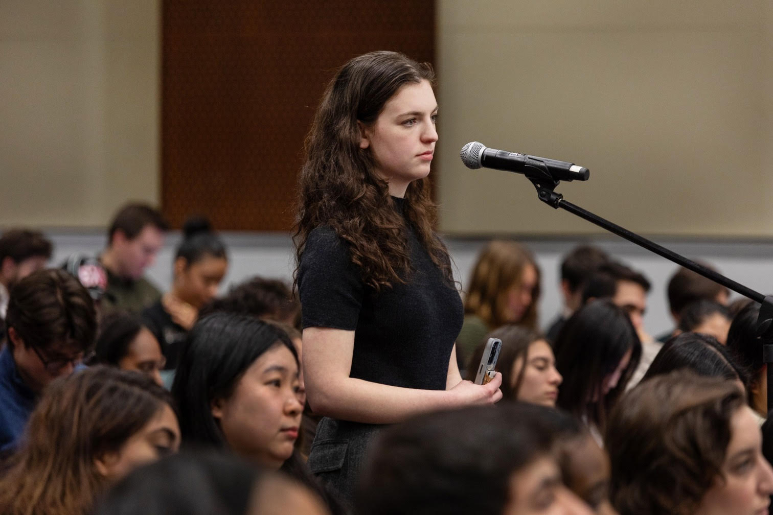 Ella-Rose Levy stands to ask a question at Columbia SIPA. 
