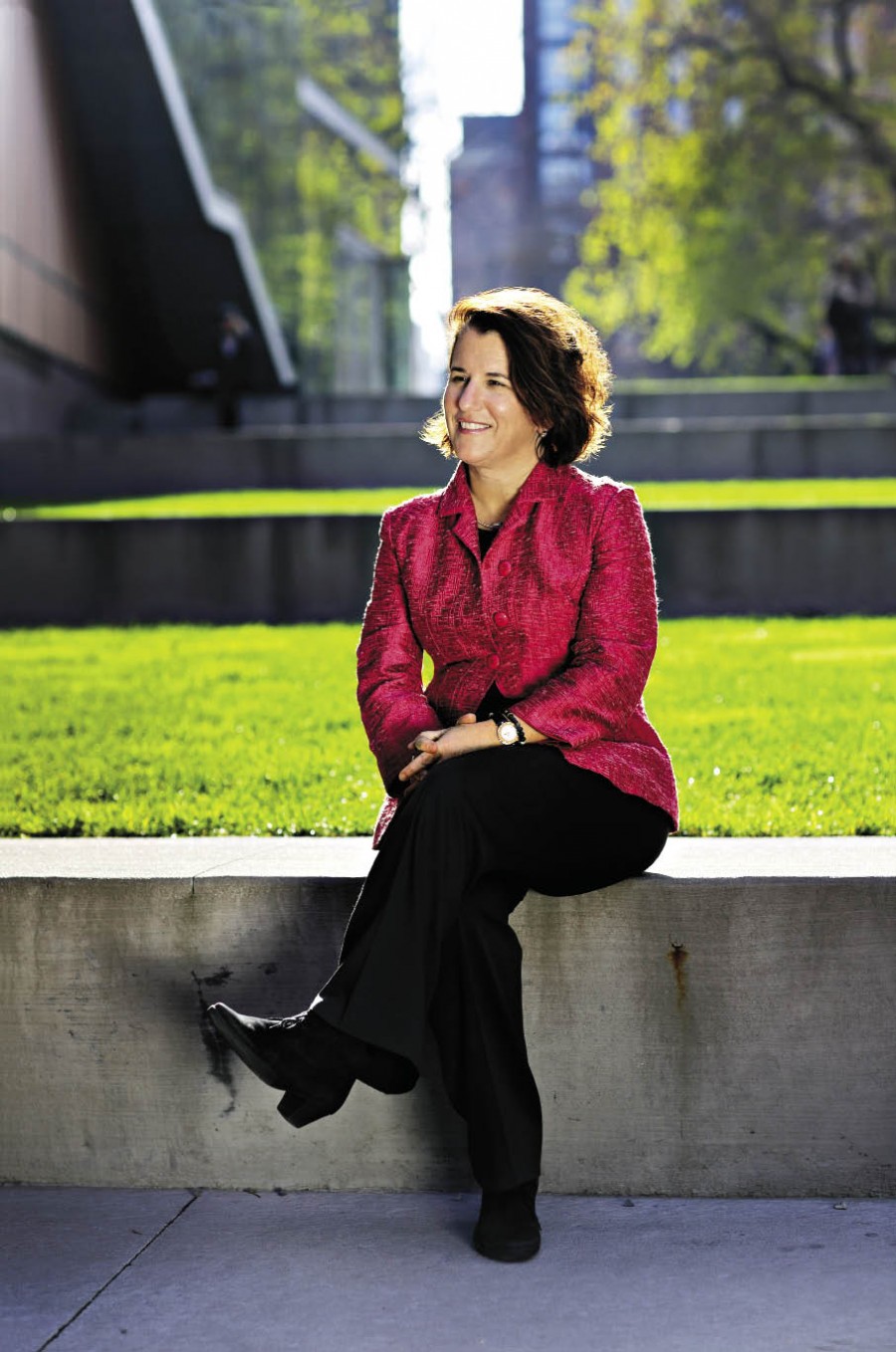 Provost Linda Bell sitting outside Barnard Campus